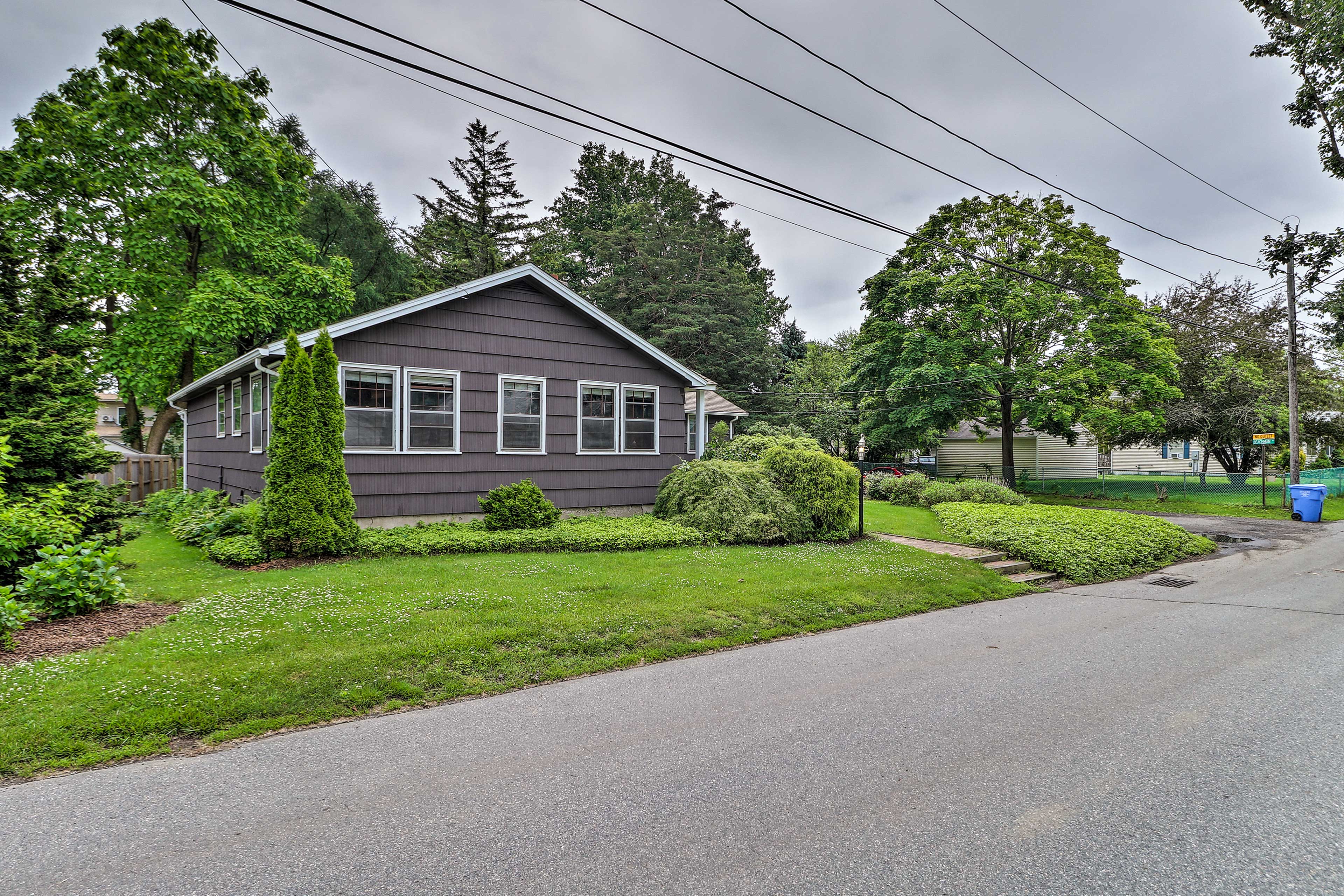 Two vehicles can park in the driveway and 2 can park in the garage.