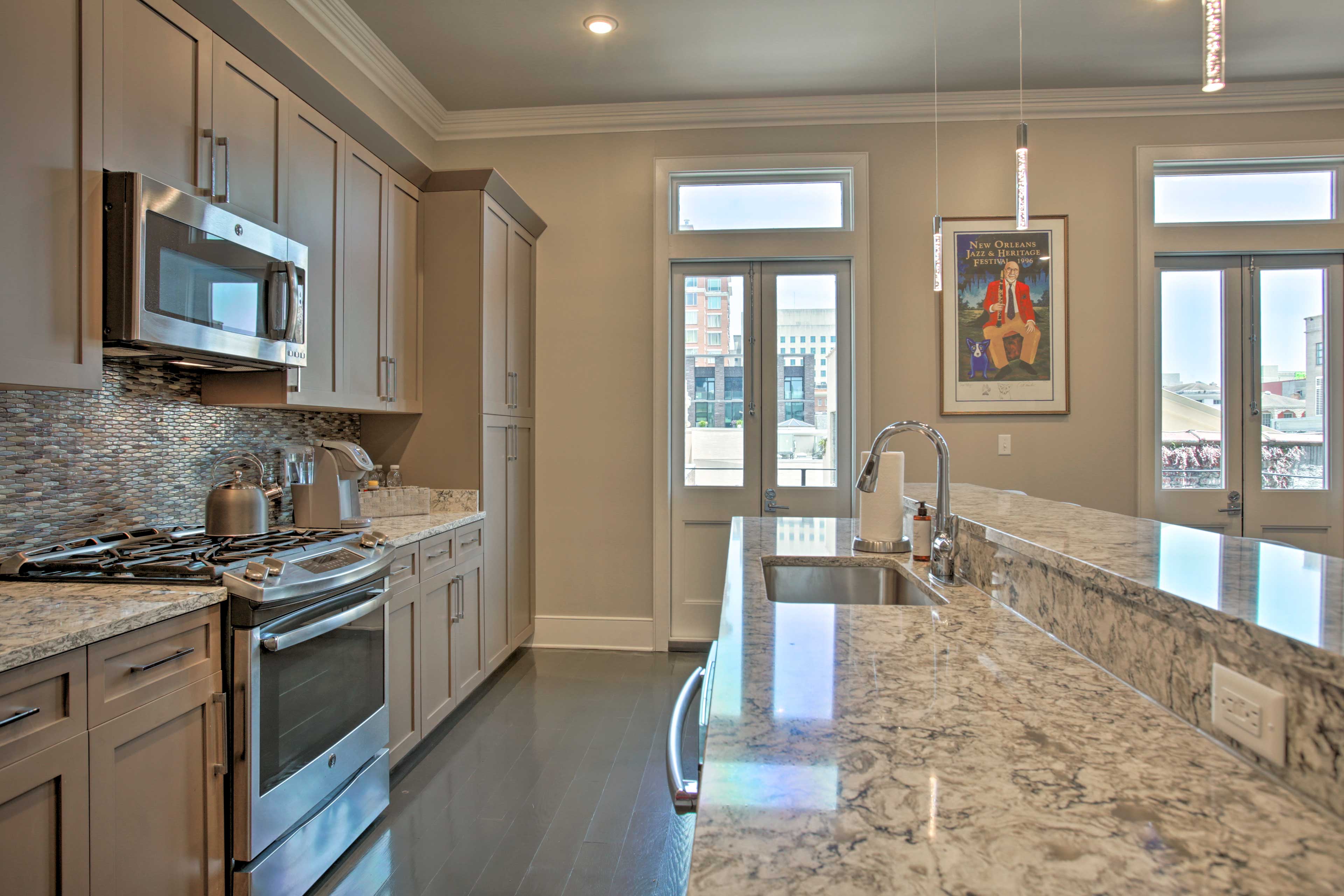 The kitchen is complete with stainless steel appliances.