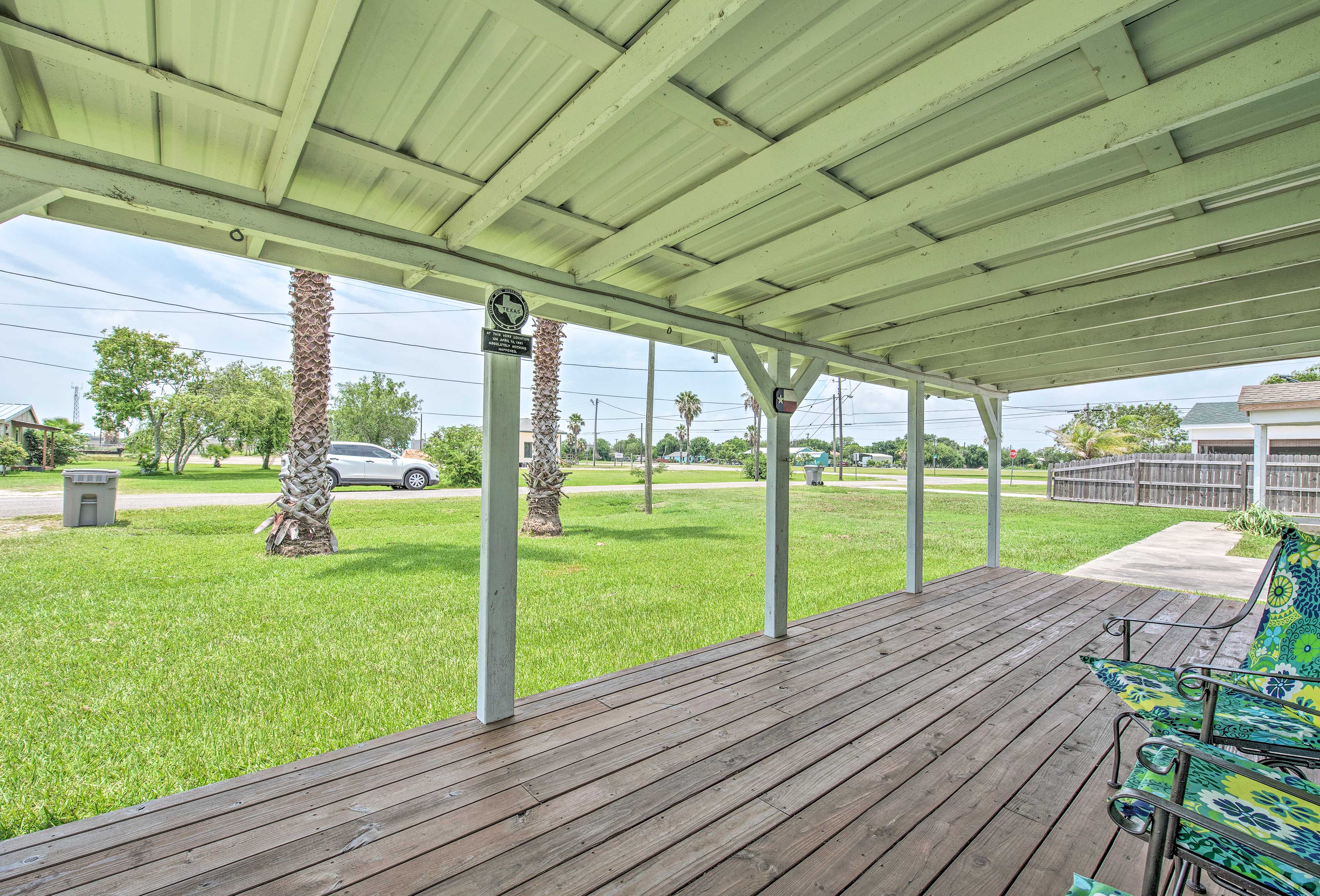 Sip on a cool, cool beverage on the covered deck of this home.