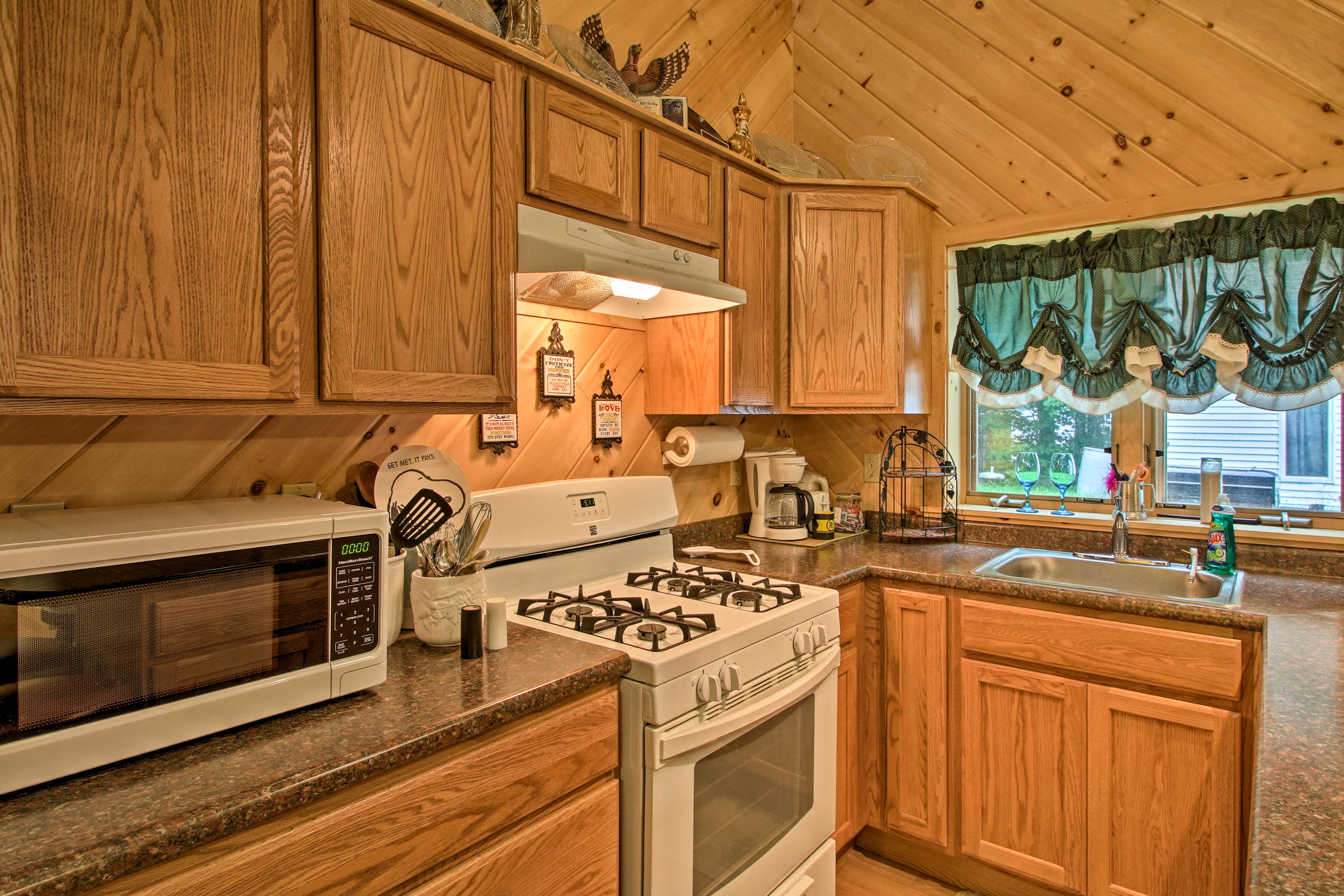 The coffee maker is tucked in the corner, promising fresh brews!