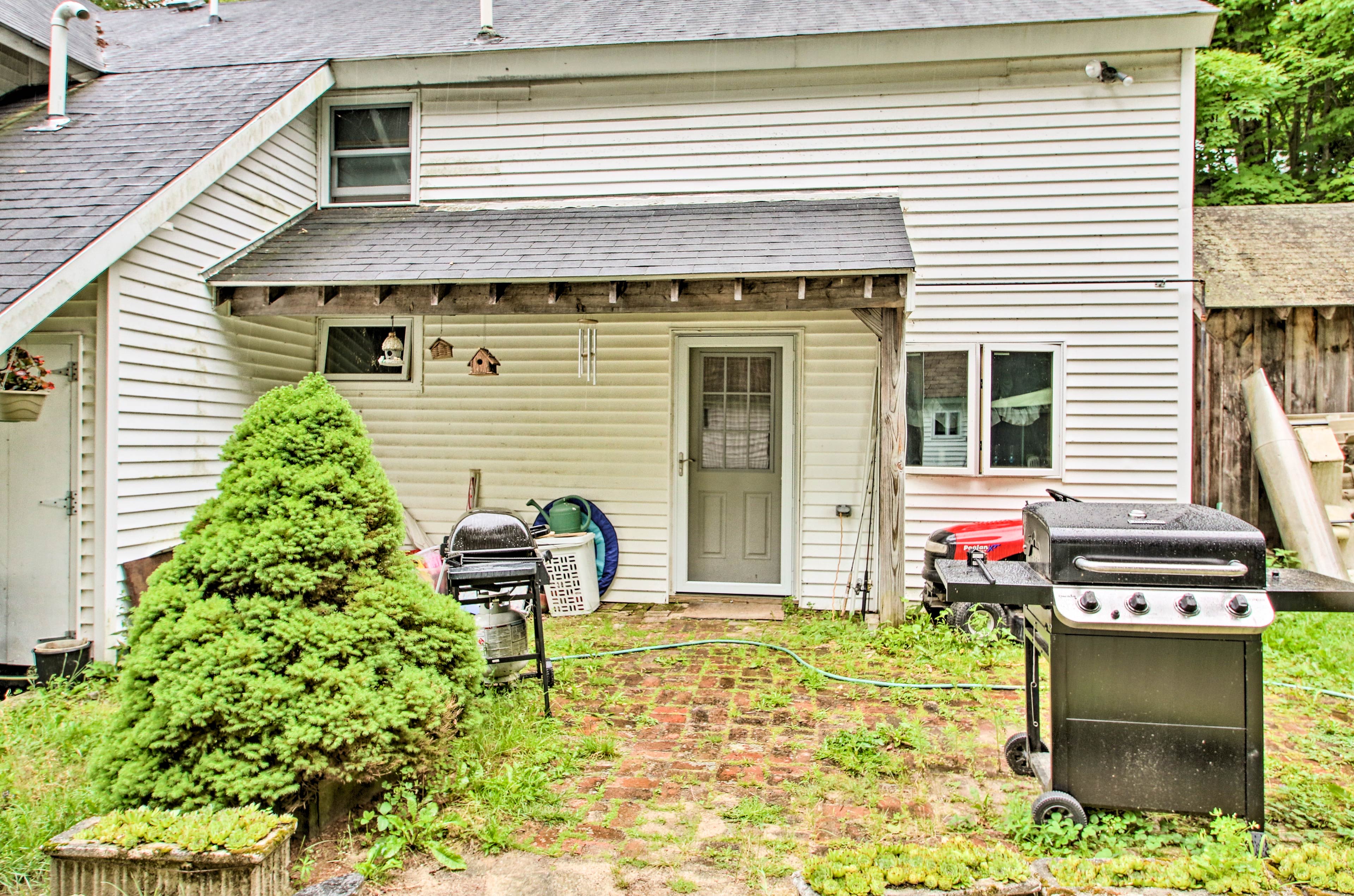 Outside, the brick patio boasts 2 gas grills.