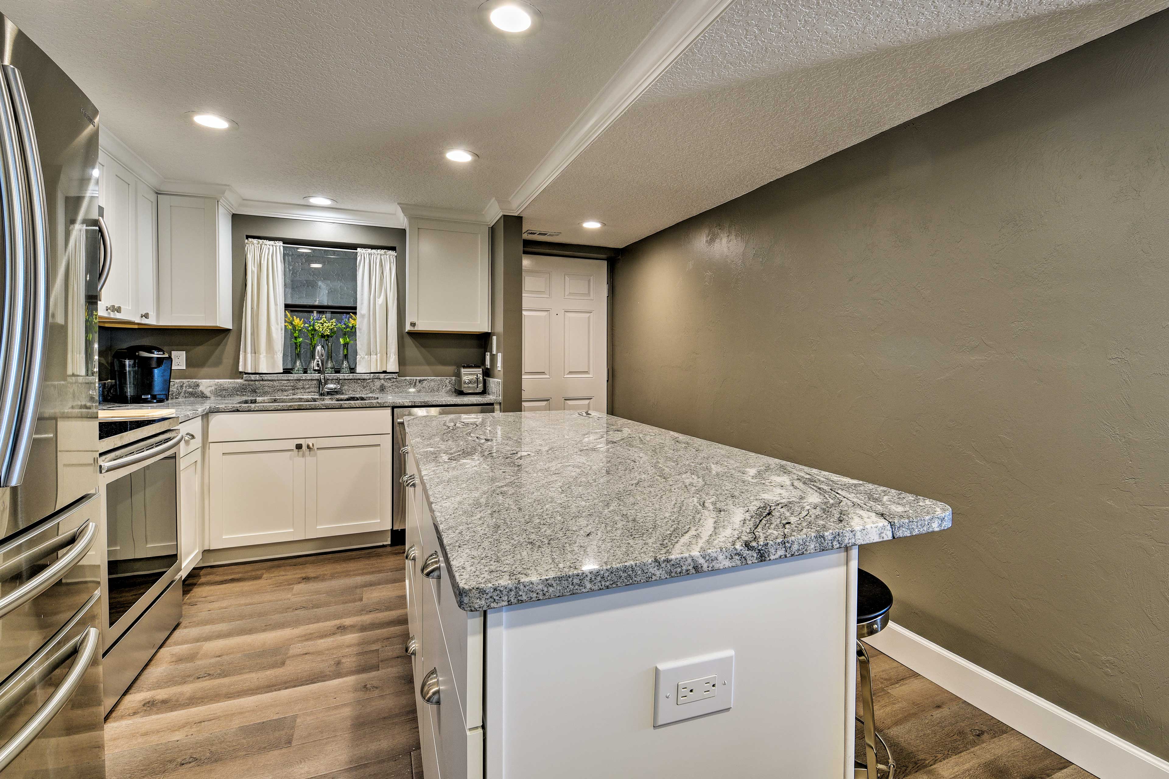 The granite topped counters offer plenty of prep space.