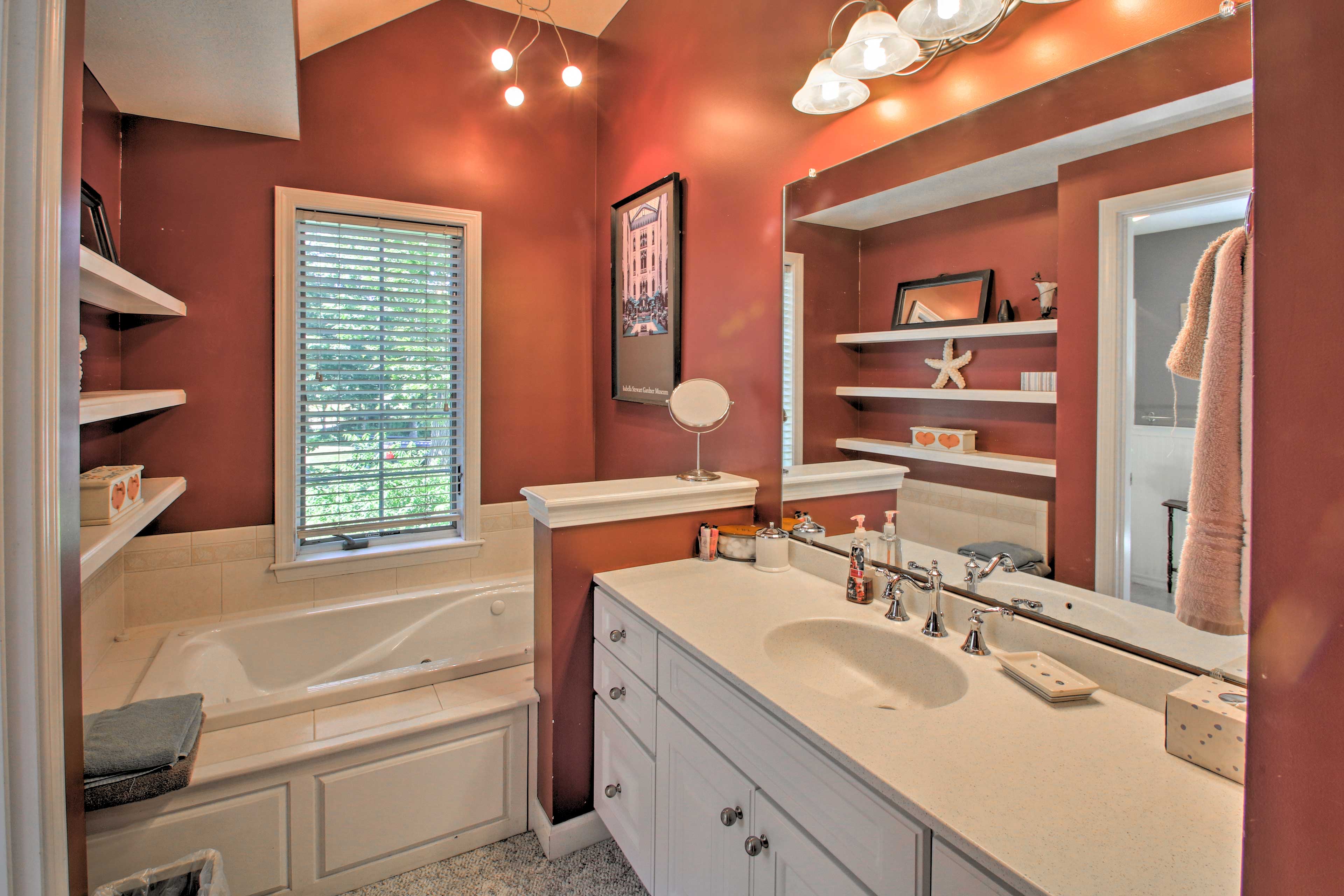 Soak in the large bathtub in the en-suite bathroom.