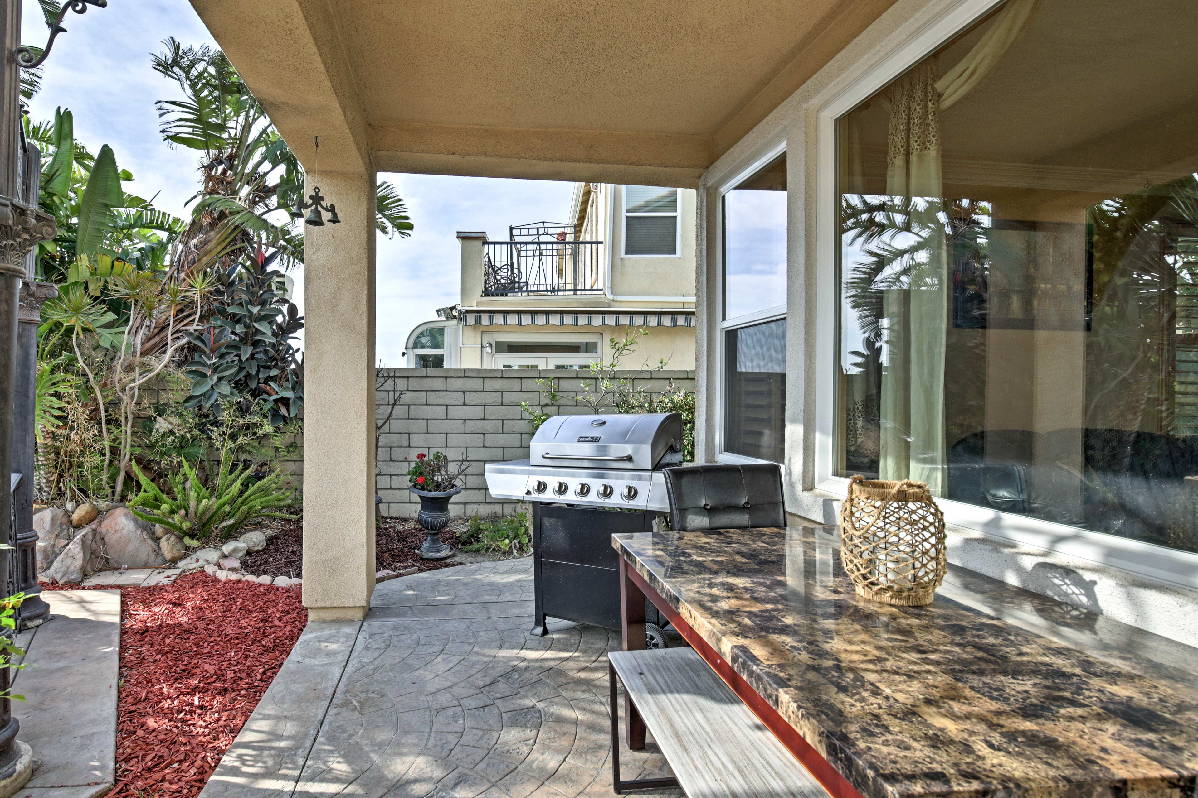 Host a barbecue in the spacious yard with a covered patio.