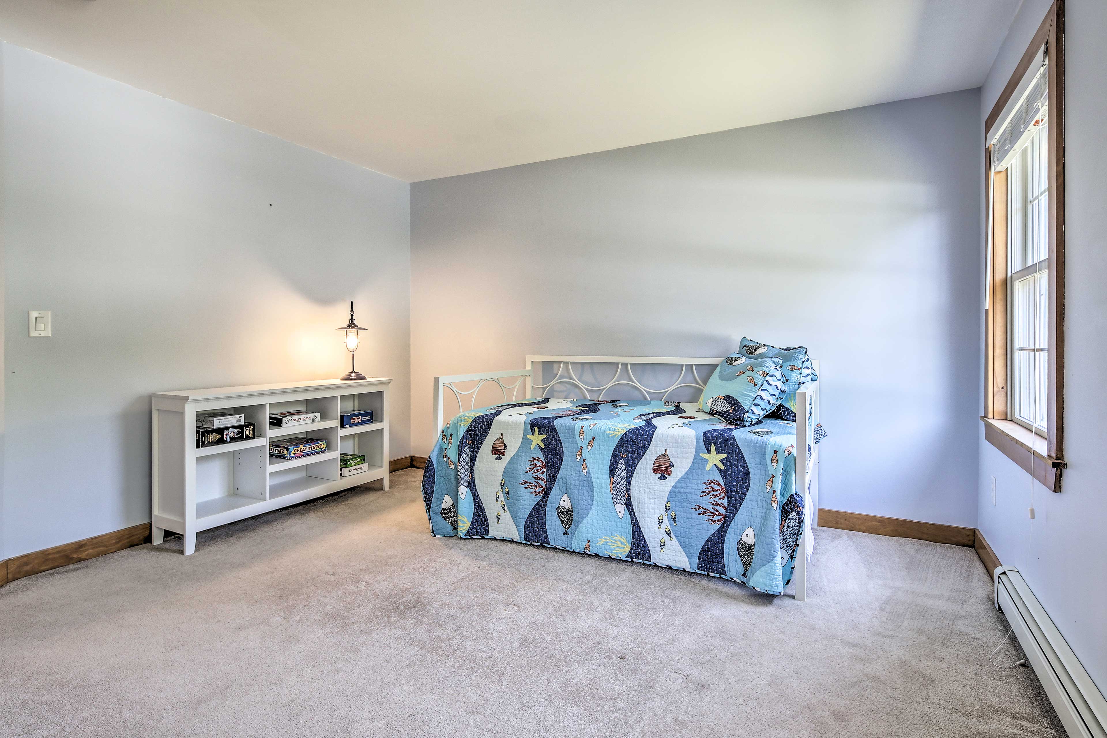 This airy bedroom offers board games and a twin daybed with a twin trundle!