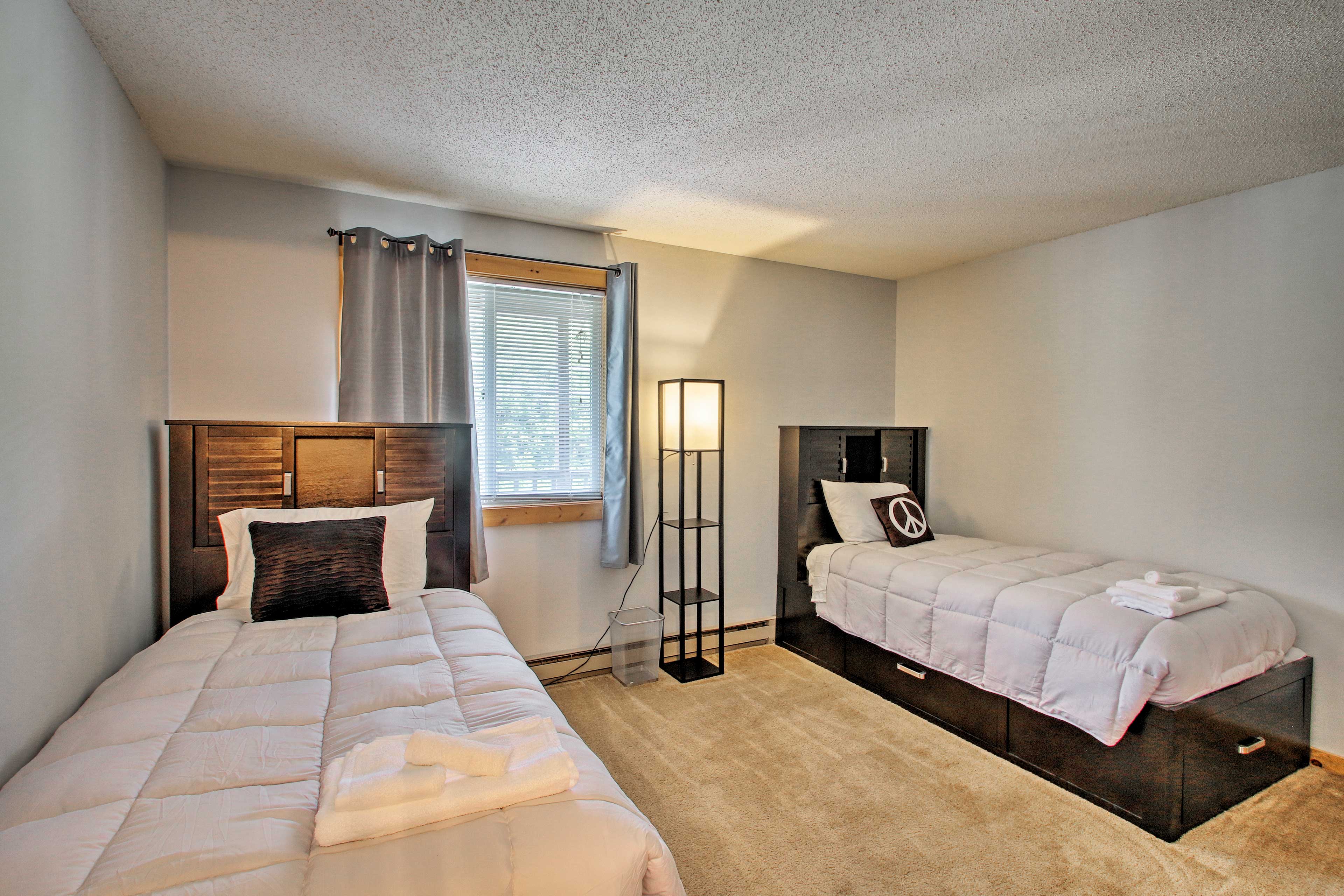 This bedroom now features a queen bed & twin bunk bed.