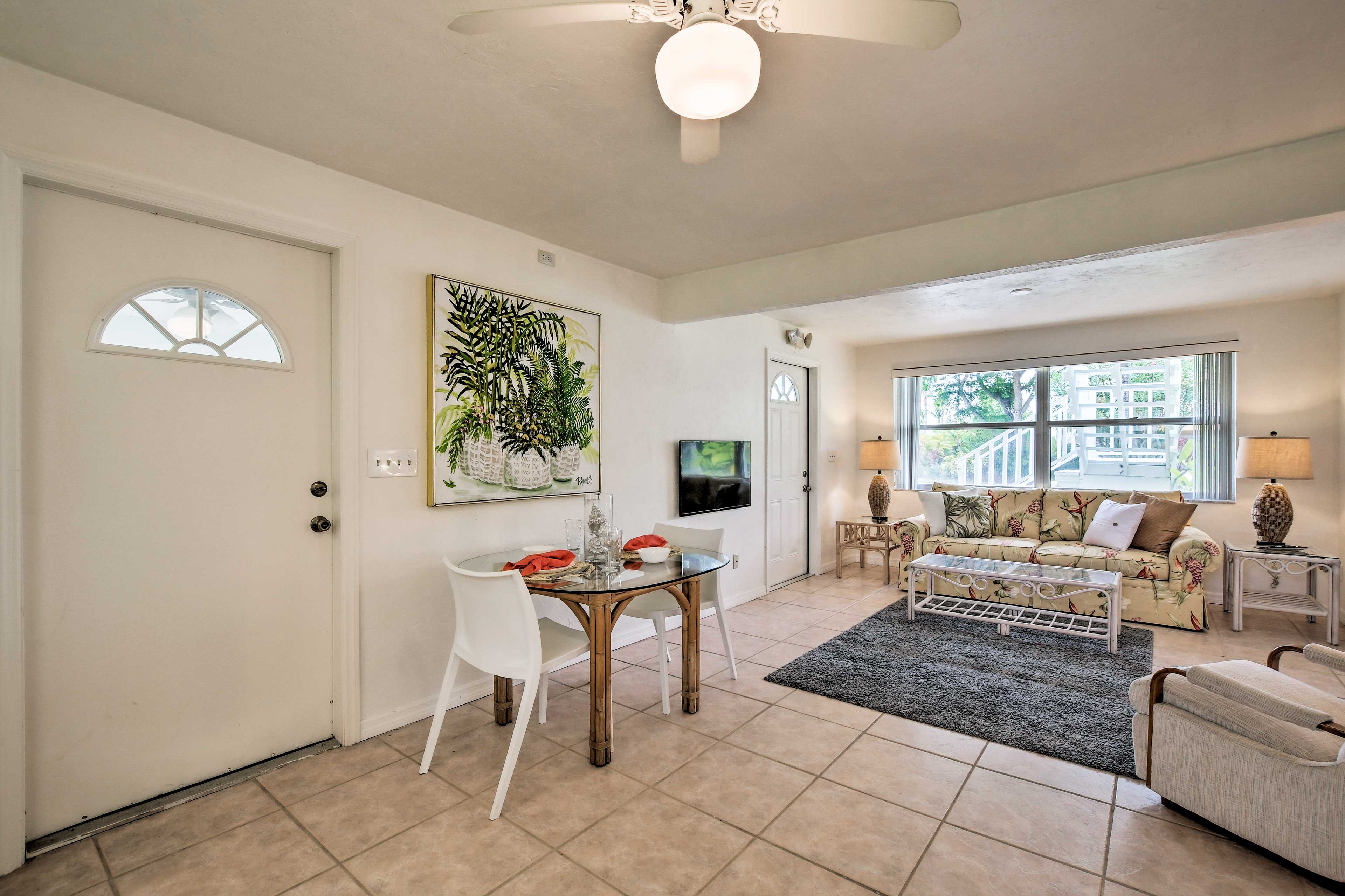 Gather around the 2-person, glass-topped dining table to dig in.