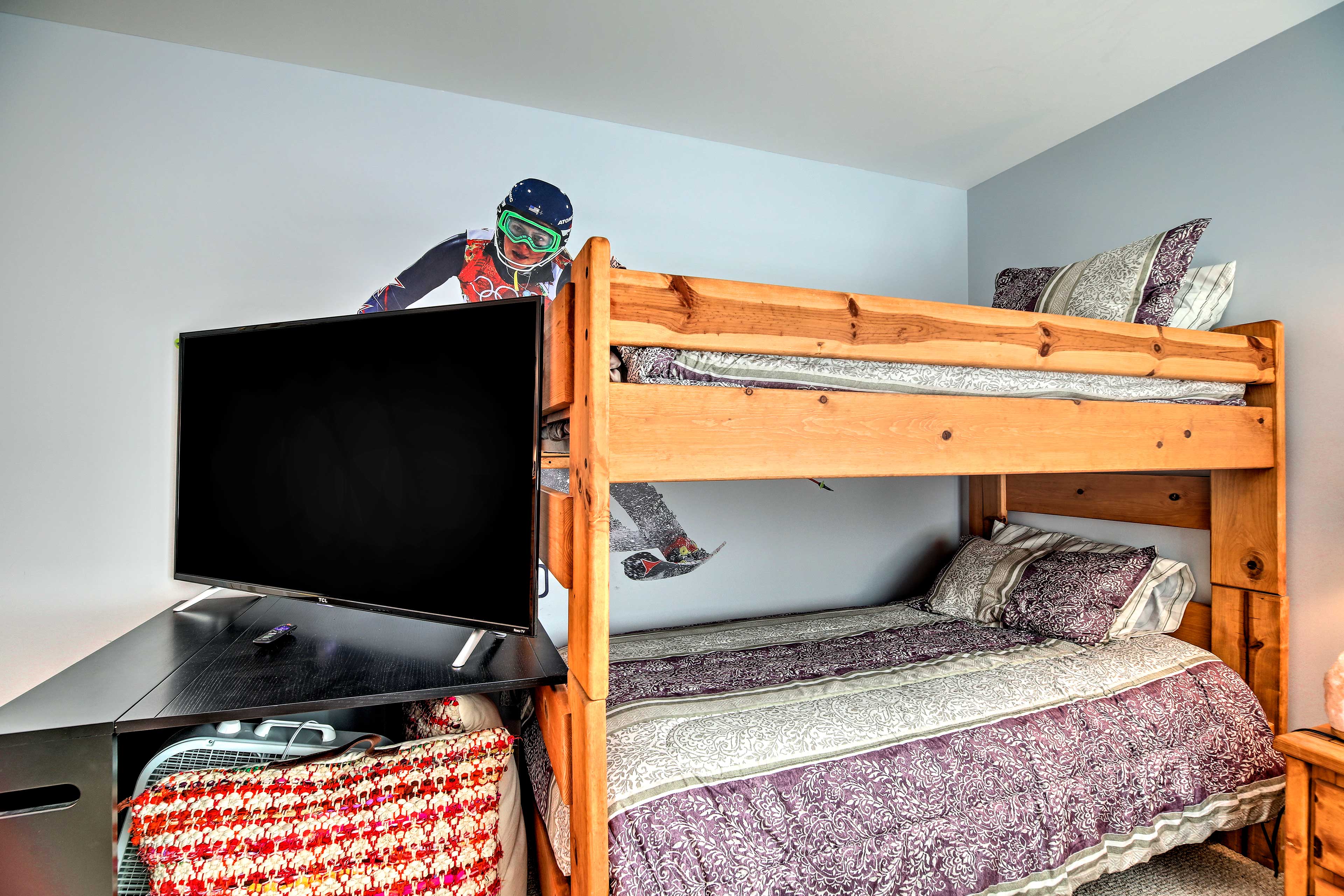 Two people can sleep in the twin-over-twin bunk bed.