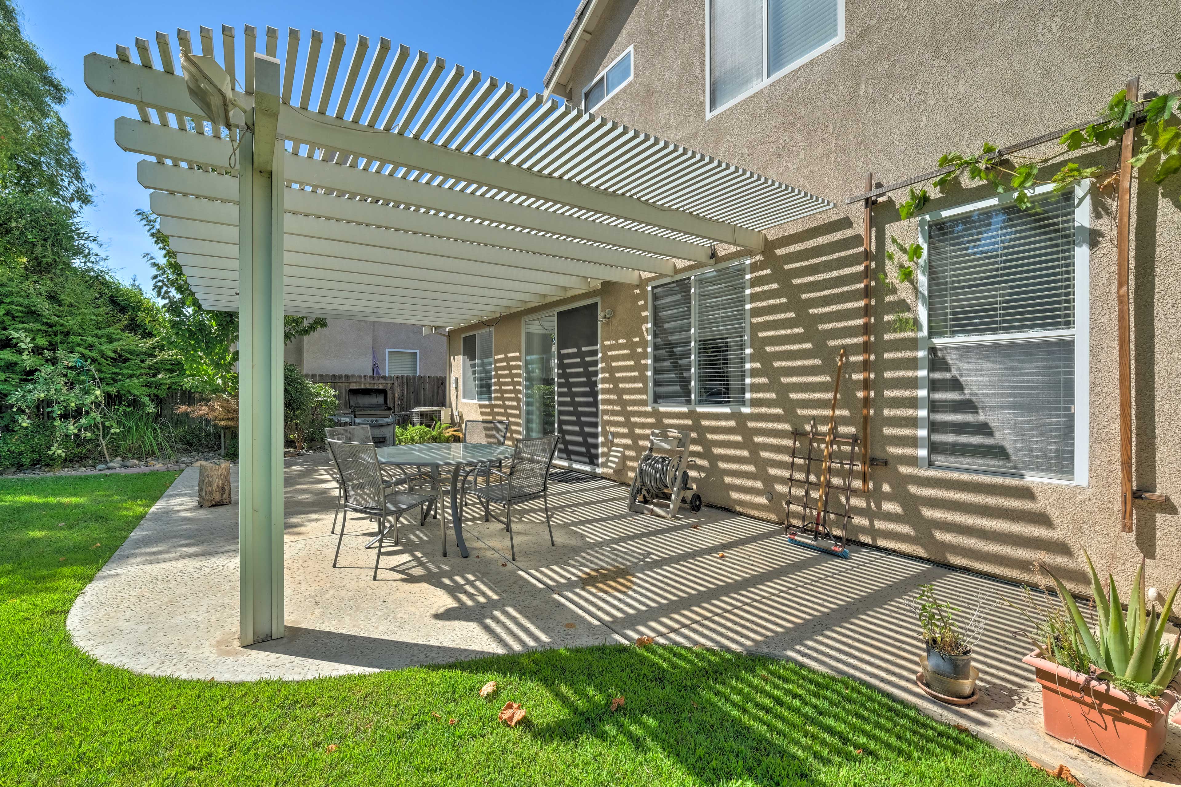 Play games and grill out in the back yard of this vacation rental.