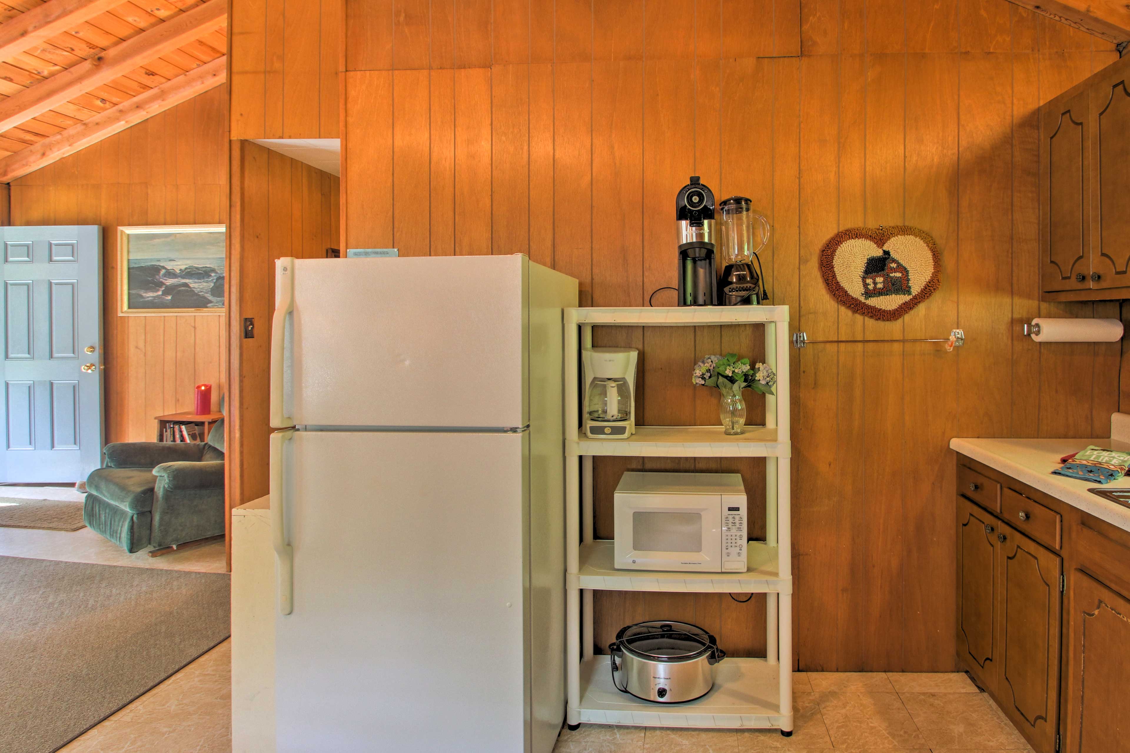 The well-equipped kitchen boasts a microwave, drip coffee maker, and Crock Pot.