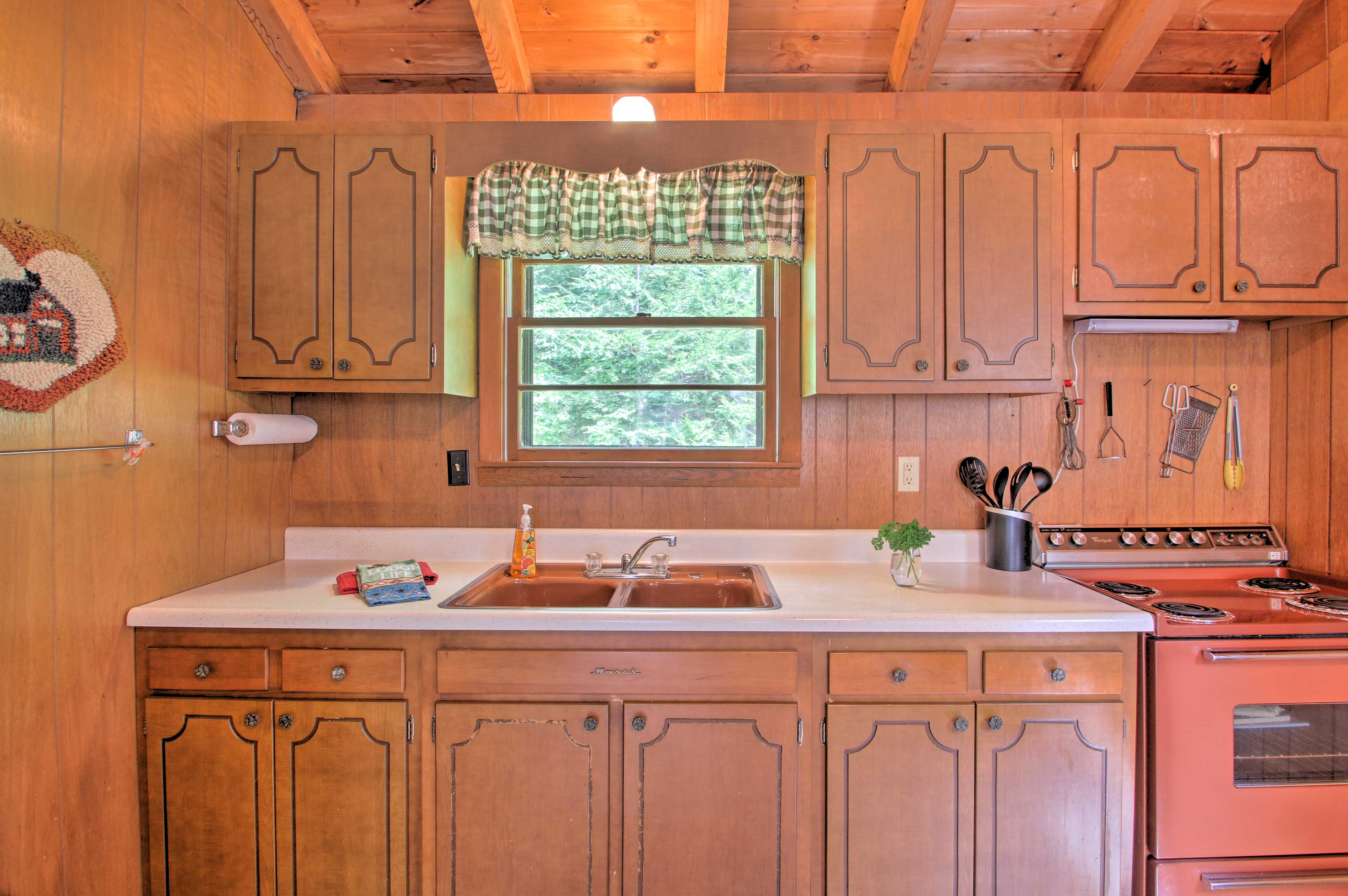 The kitchen boasts charming wooden cabinets.