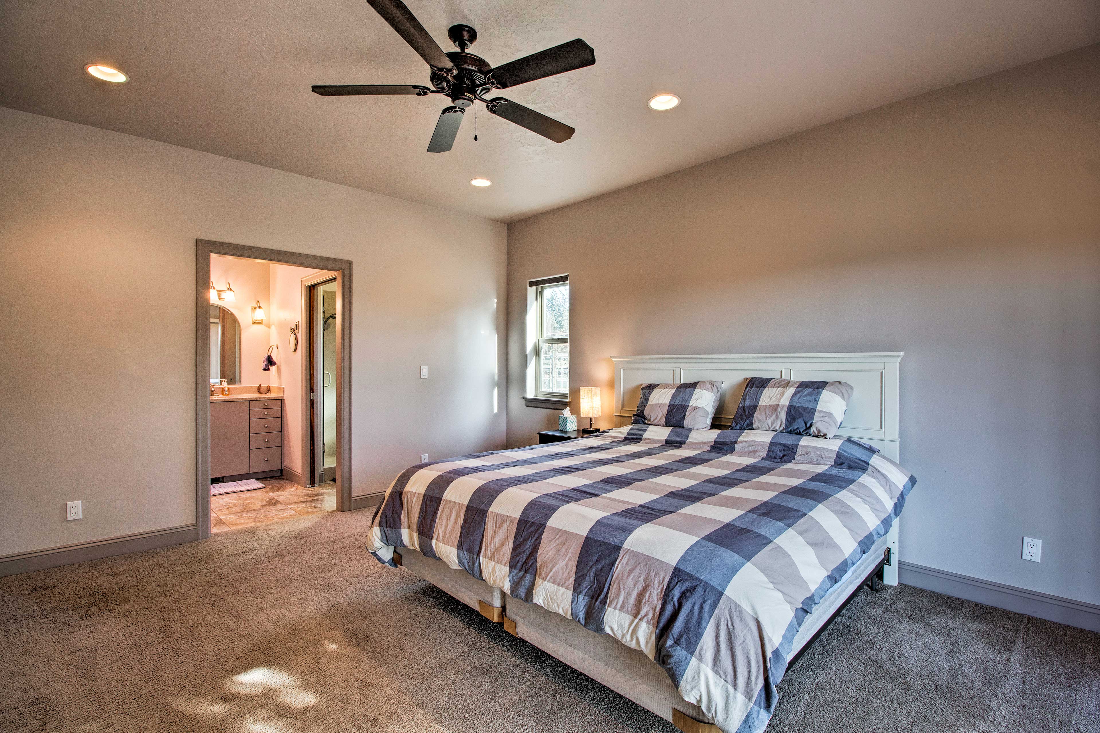 This bedroom features a fireplace, flat-screen TV, and an en-suite bathroom.