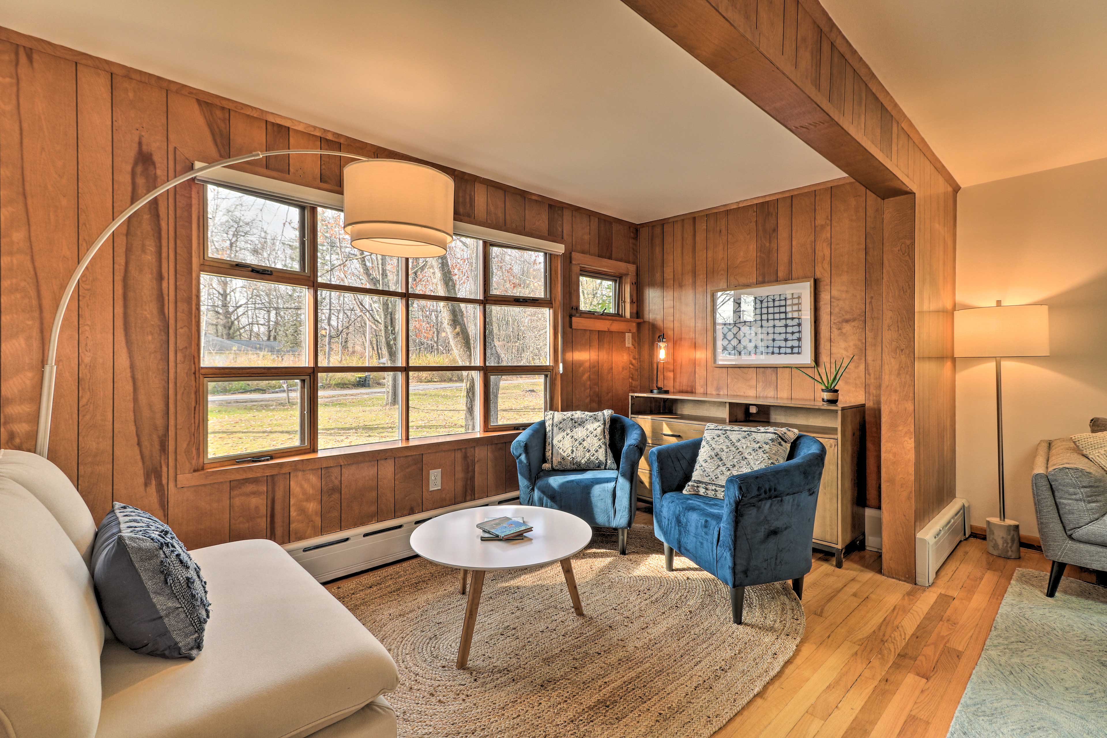 This sunny reading nook features picture windows.