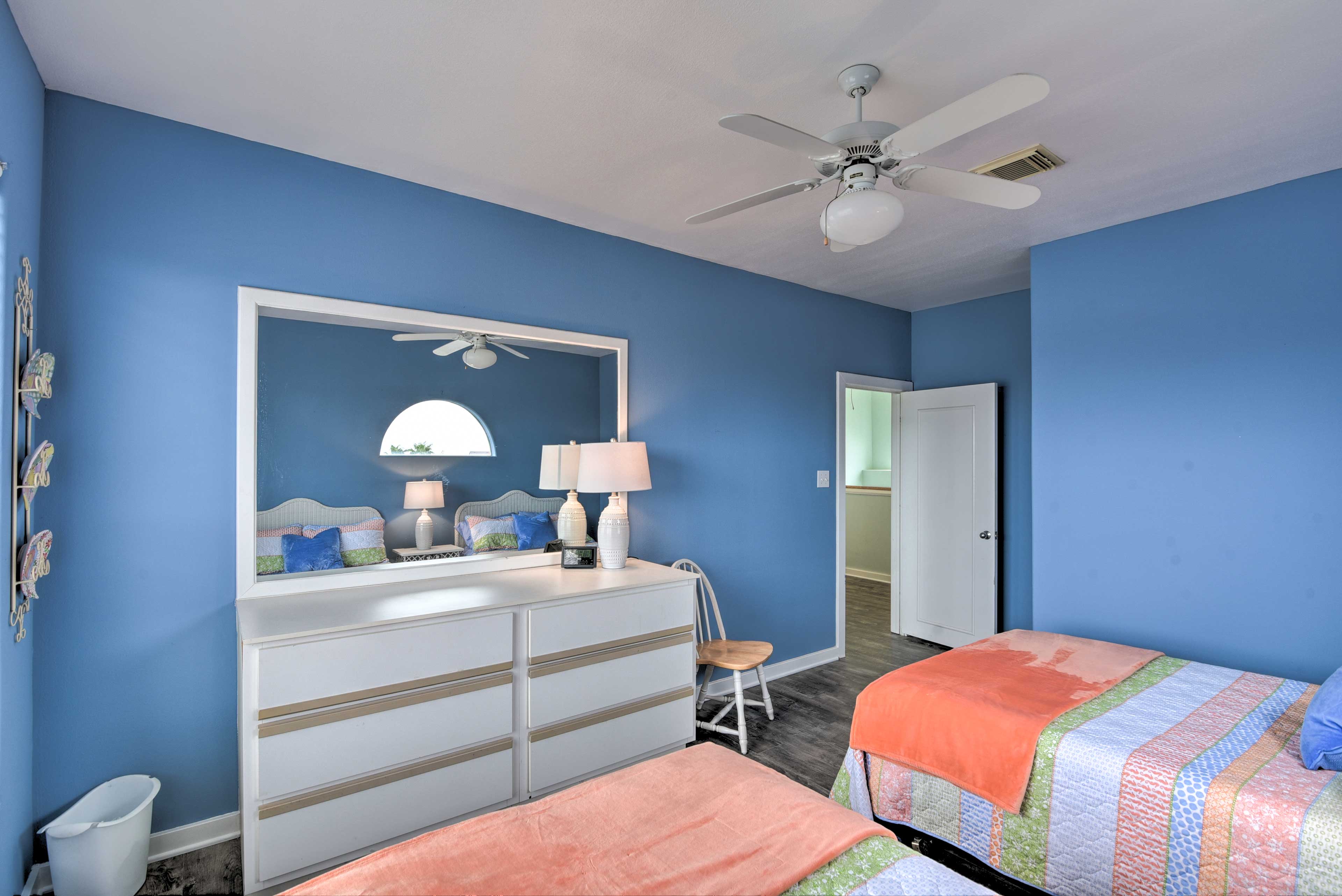 Each bedroom is tastefully-outfitted with colorful decor.