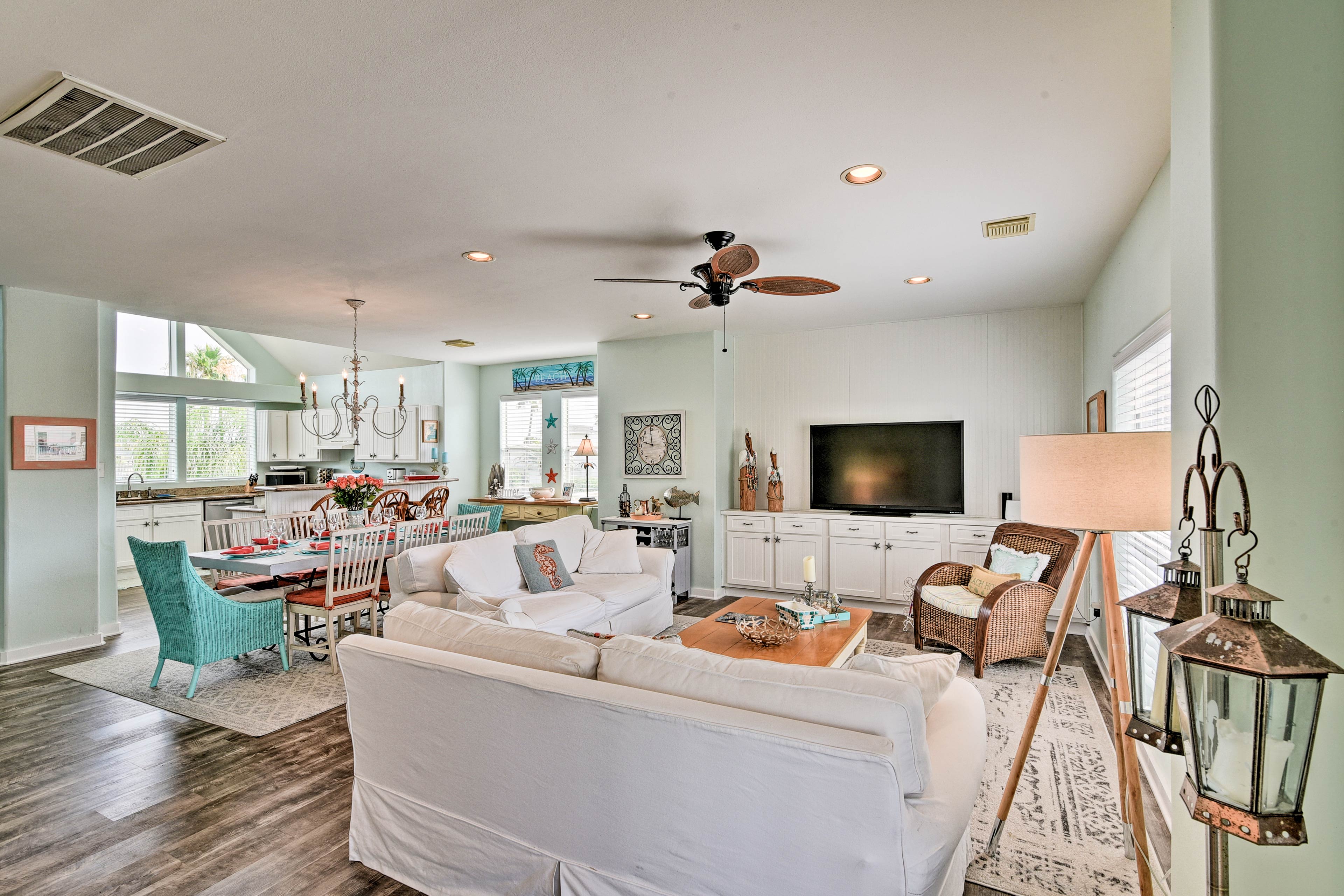 Coral and turquoise accents highlight the living room.