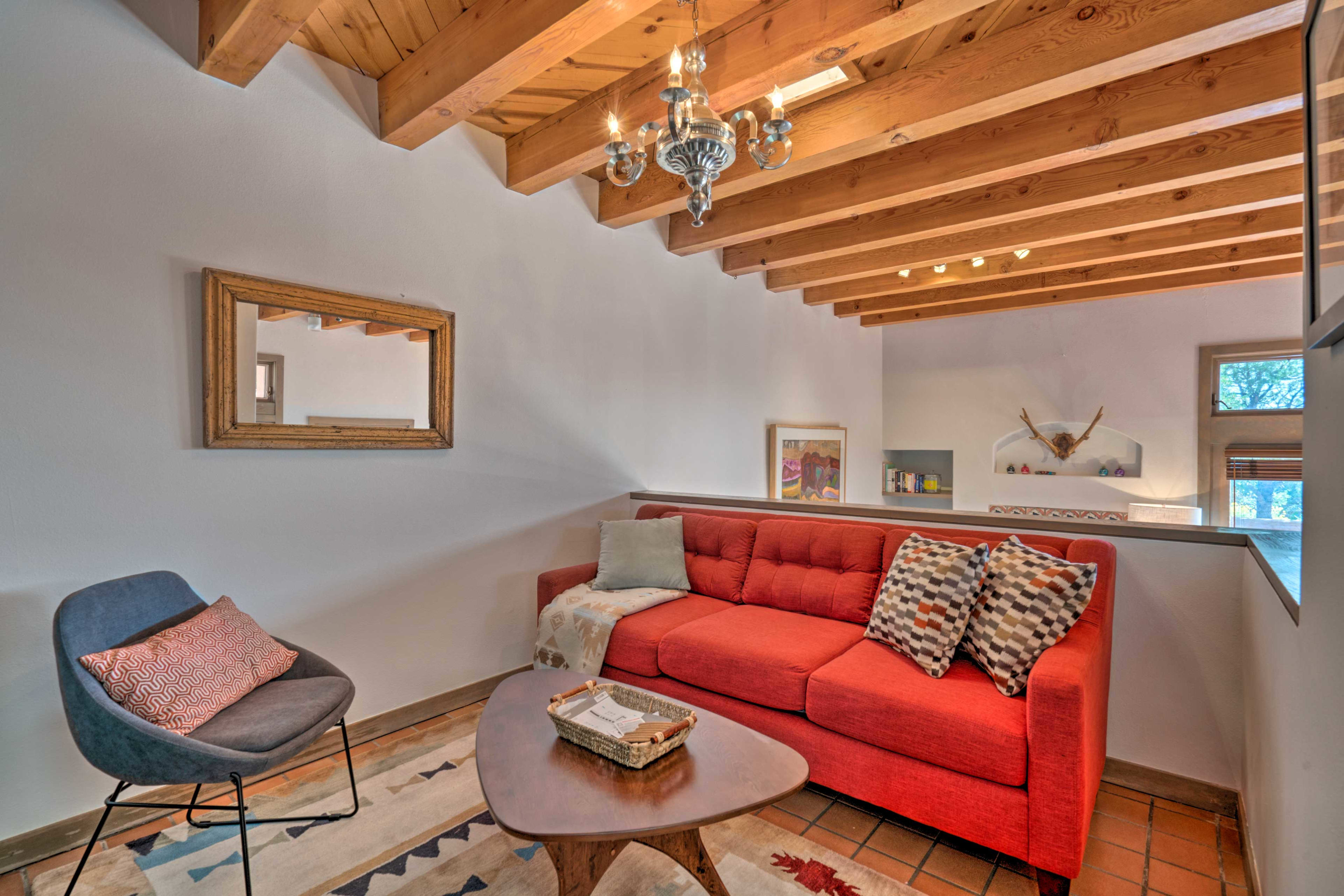 A second furnished living space awaits in the upper-level loft.