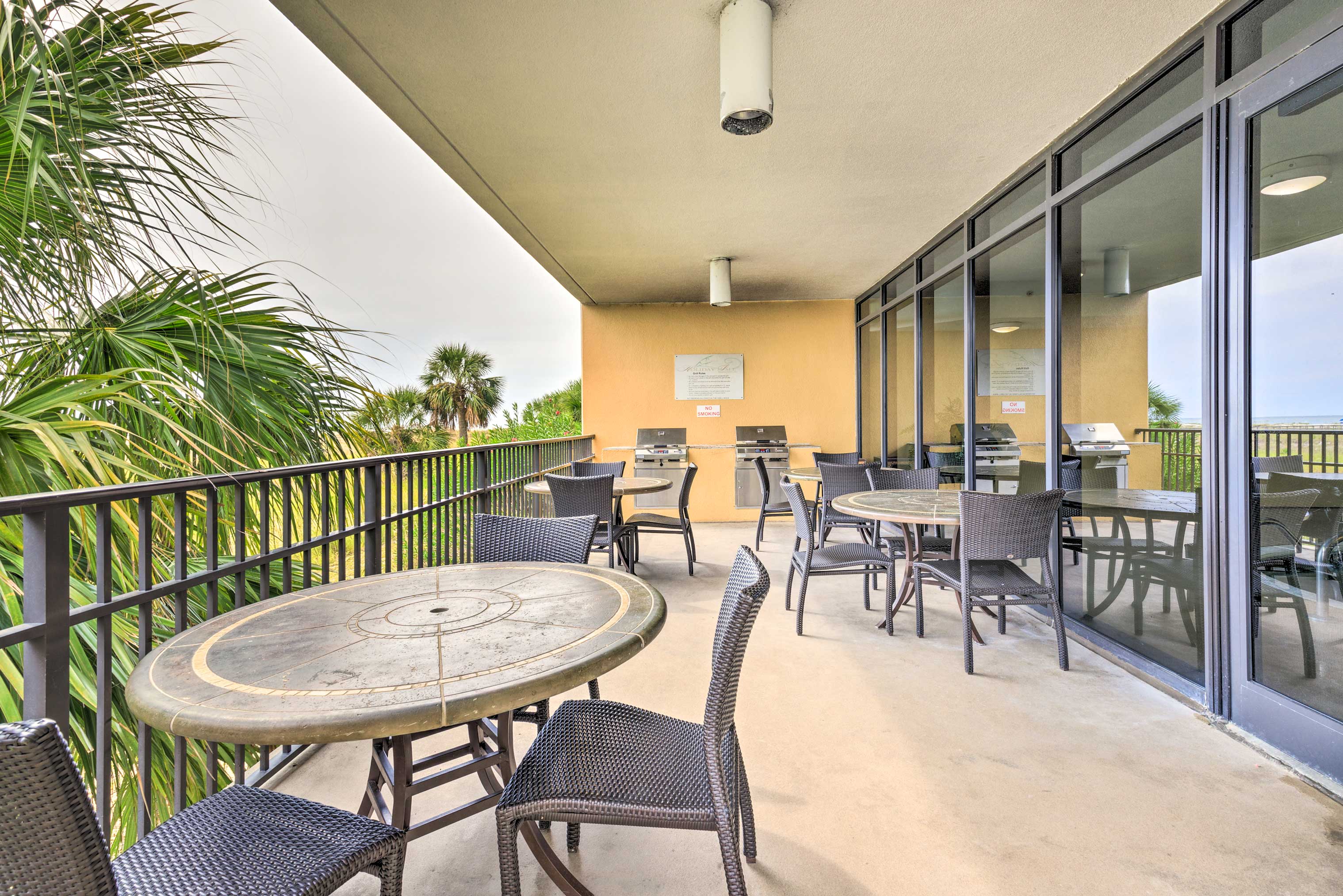 The resort amenities include an outdoor dining area with BBQ grills.