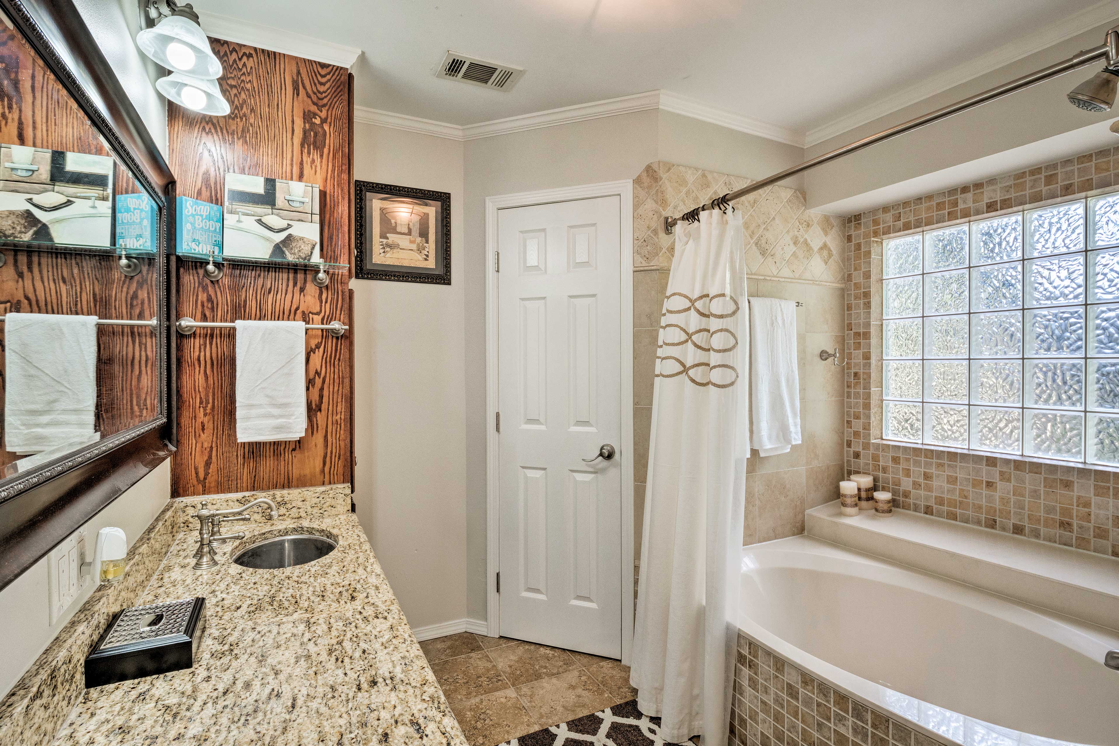 The room has a garden tub and dual sinks!