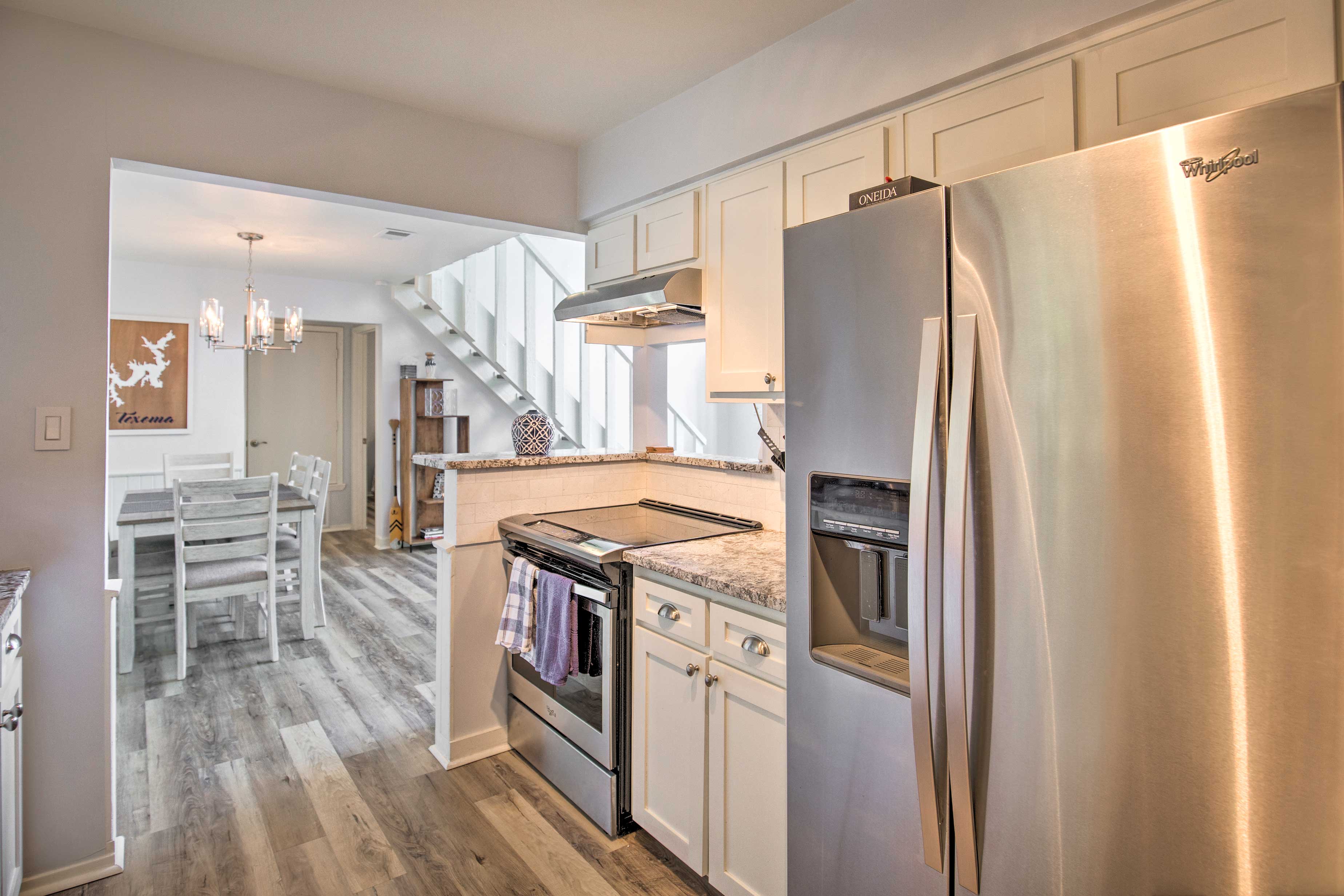 The fully equipped kitchen features stainless steel appliances.