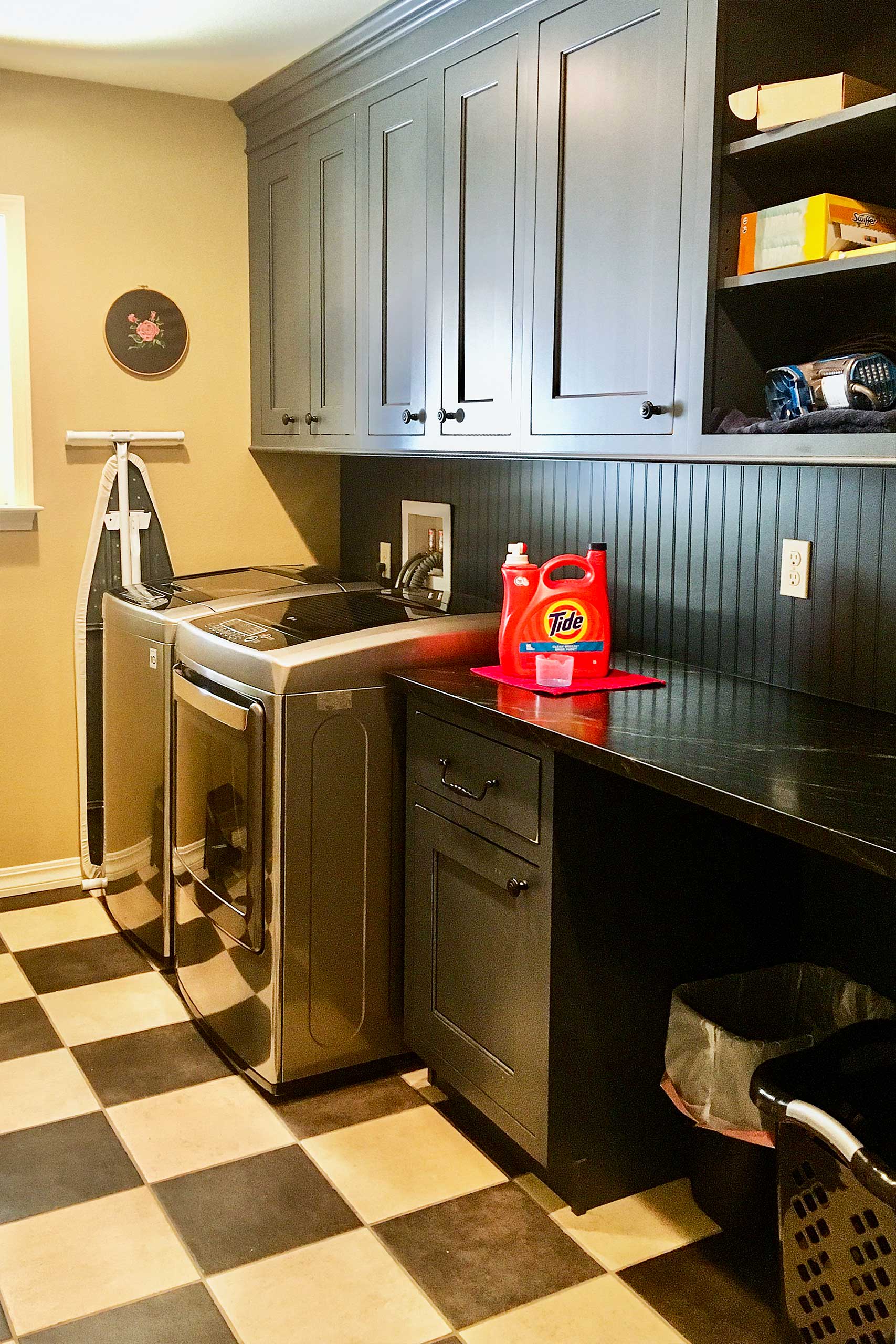 The laundry room is well-equipped with all the cleaning essentials!