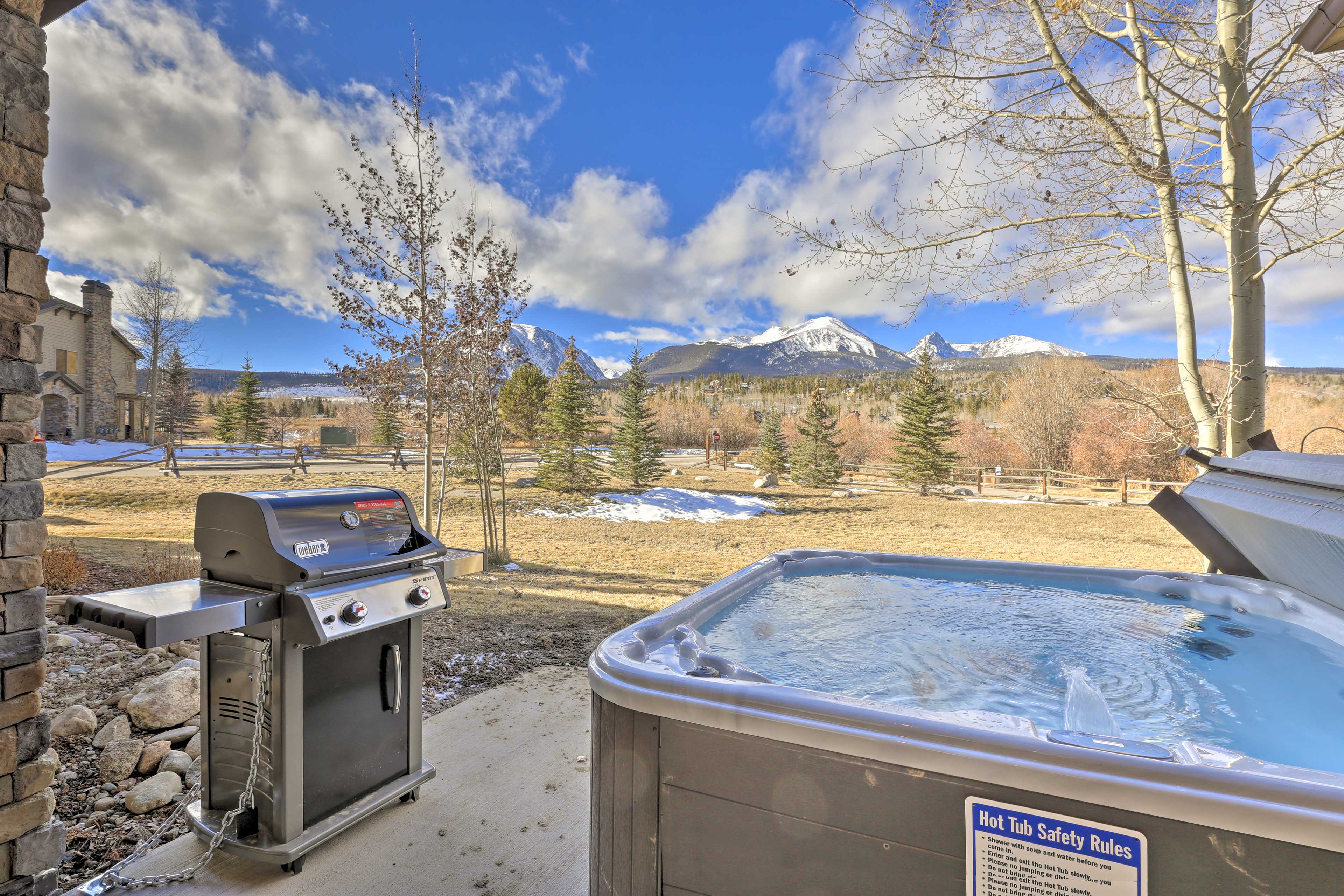 Soak in the private hot tub that is offered at this vacation rental.