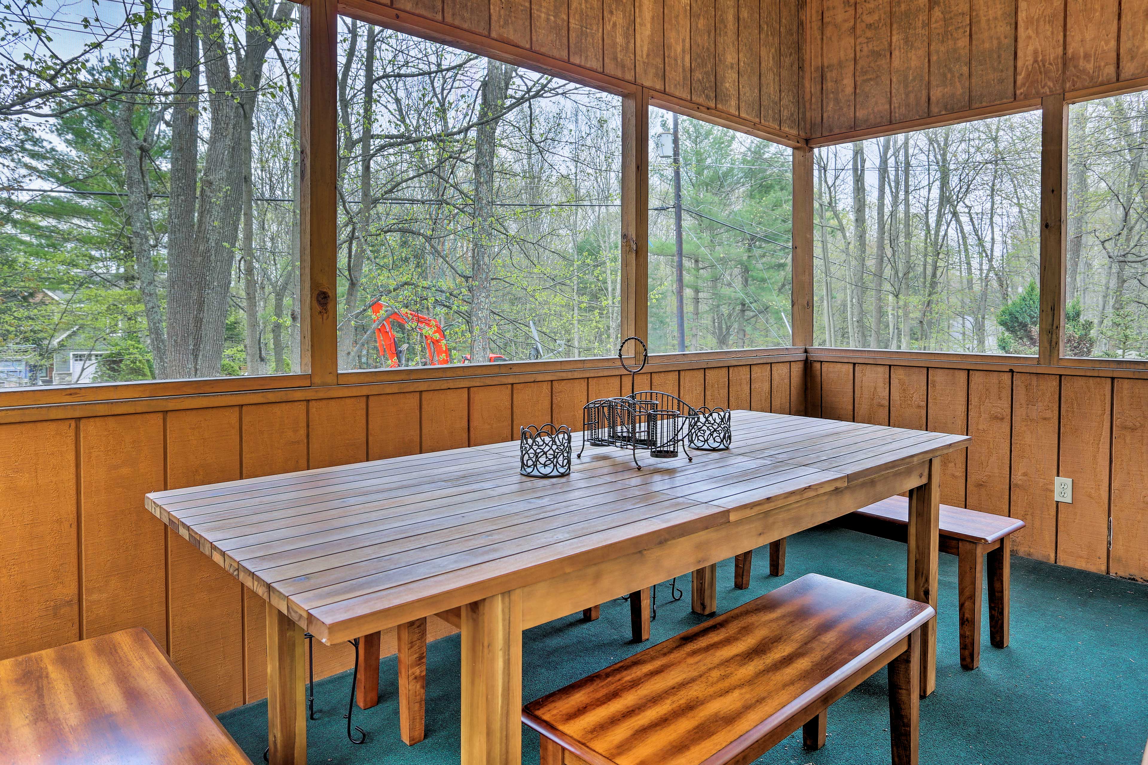 Enjoy the nice weather out on the screened-in porch.