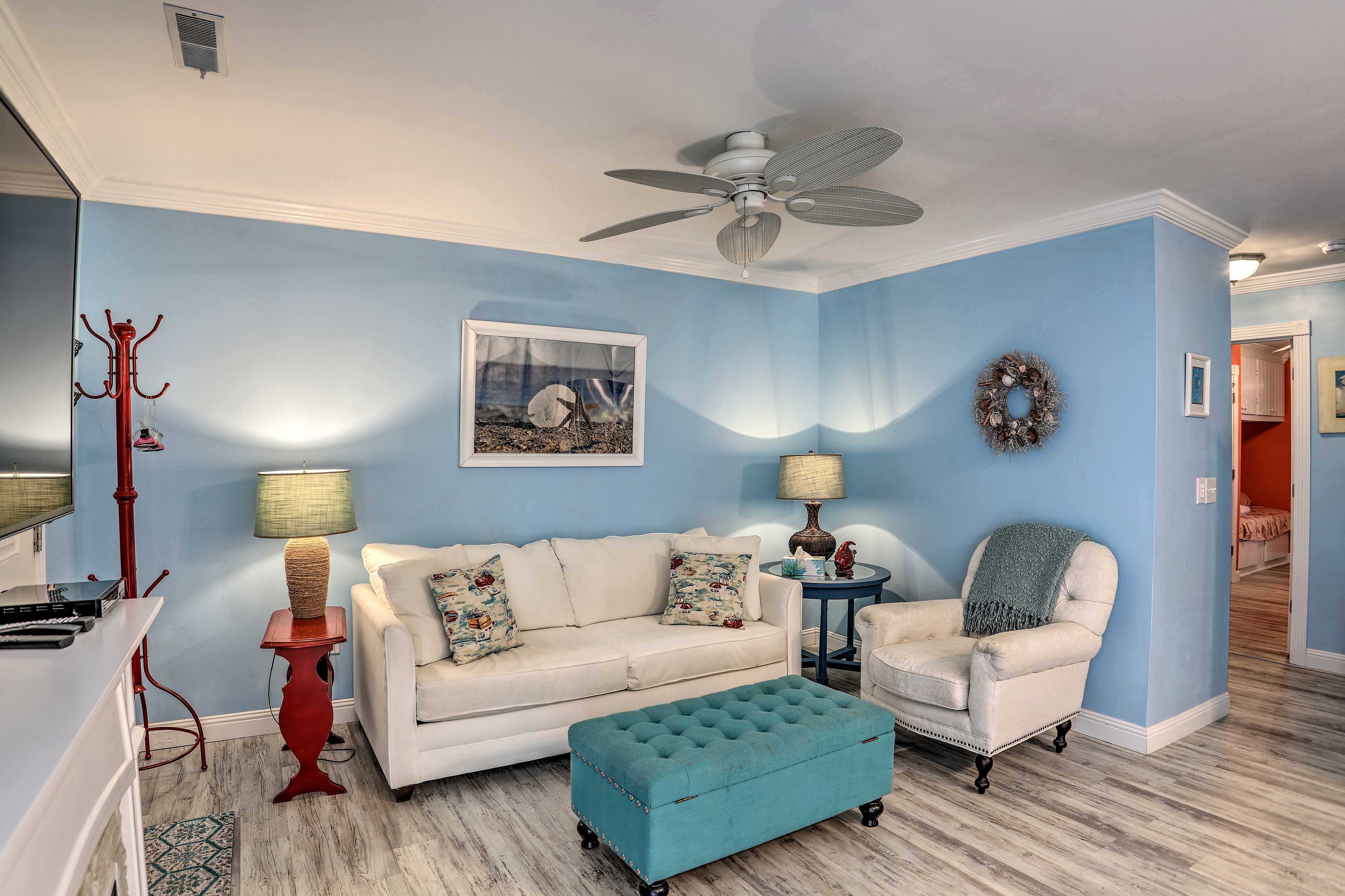 Lounge in this 2-bedroom, 2-bath condo after a trip to the beach!