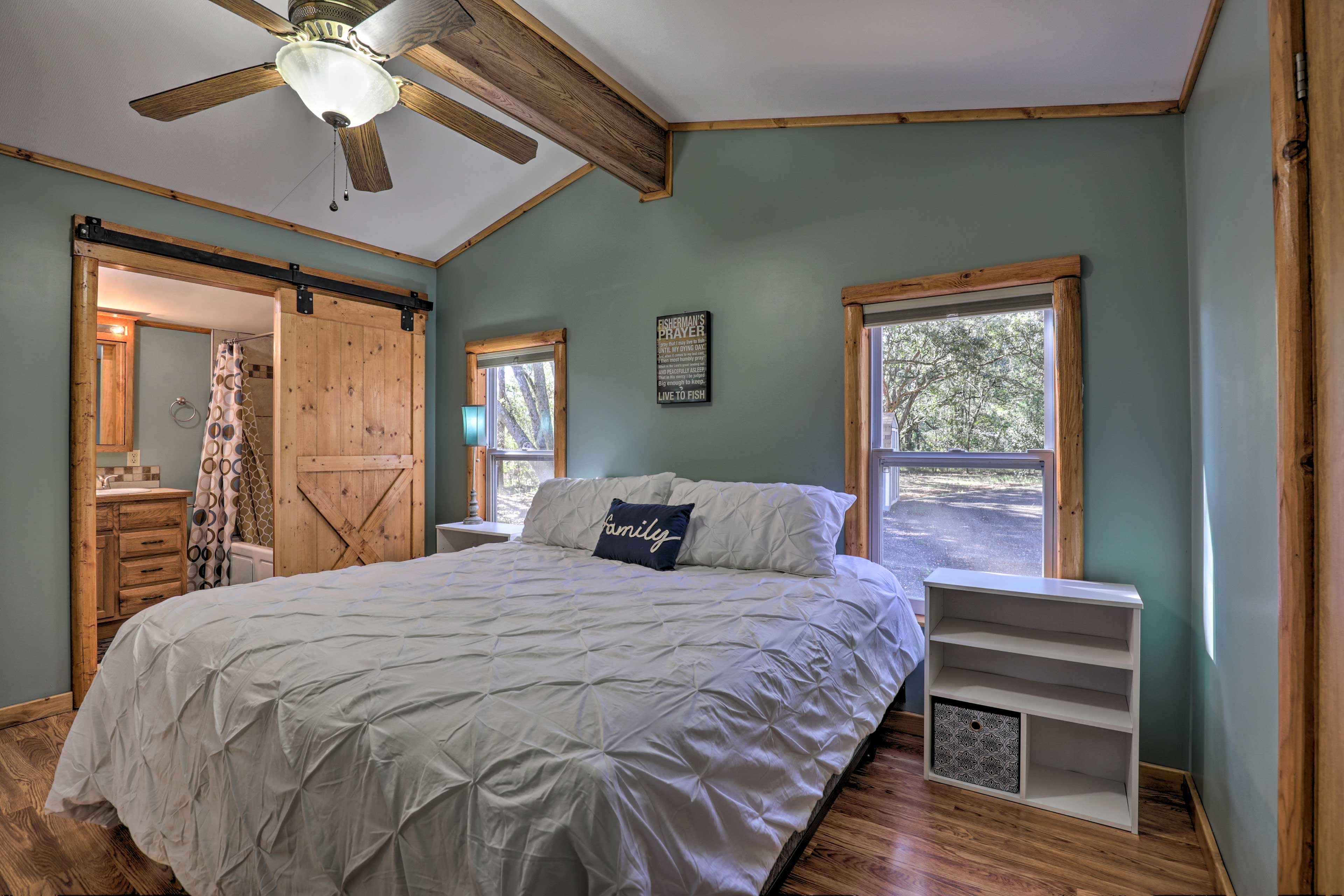 This master bedroom features a king-bed and an en-suite bathroom.