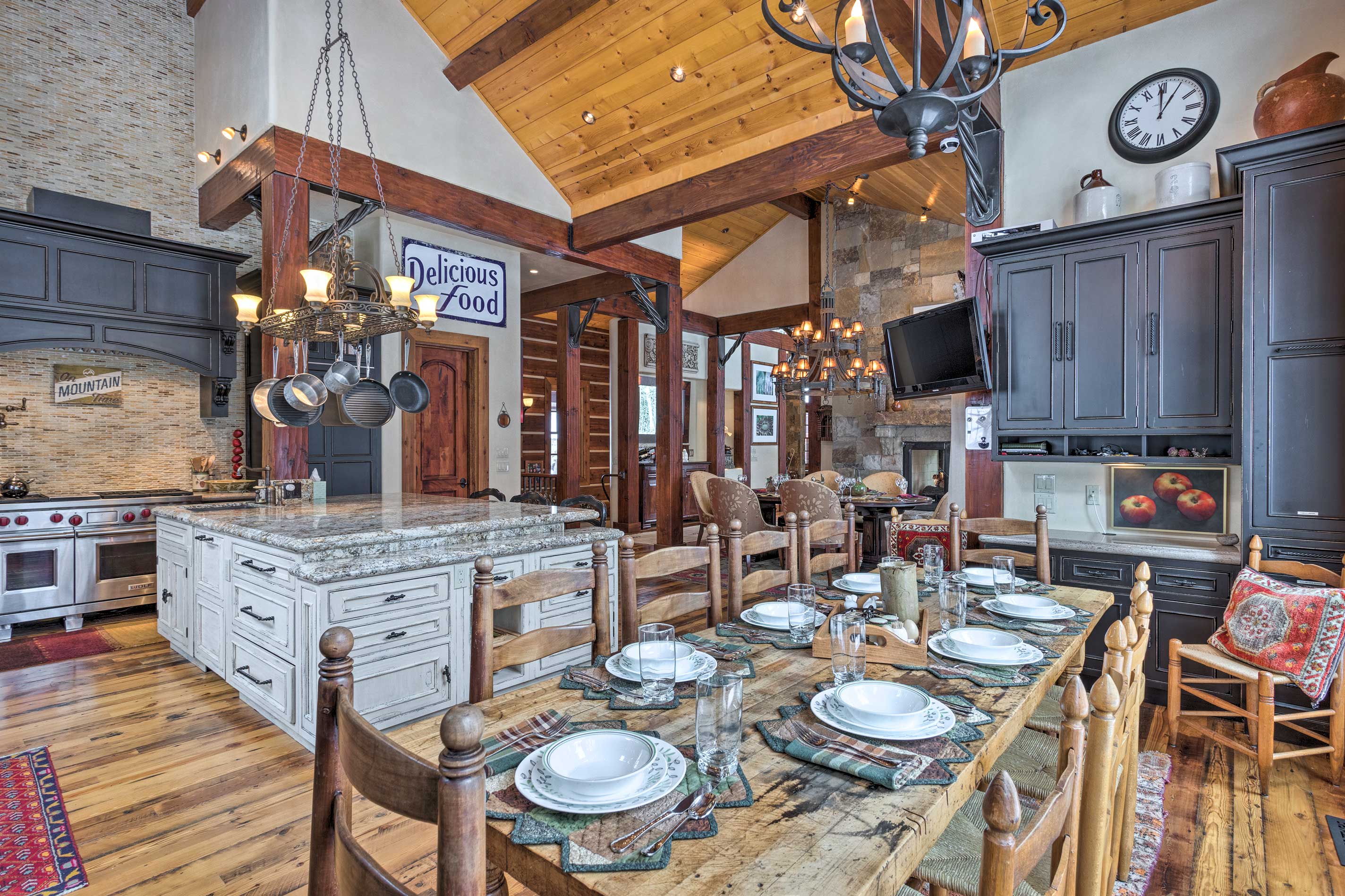 Share a delicious home-cooked meal around the spacious wood dining table.