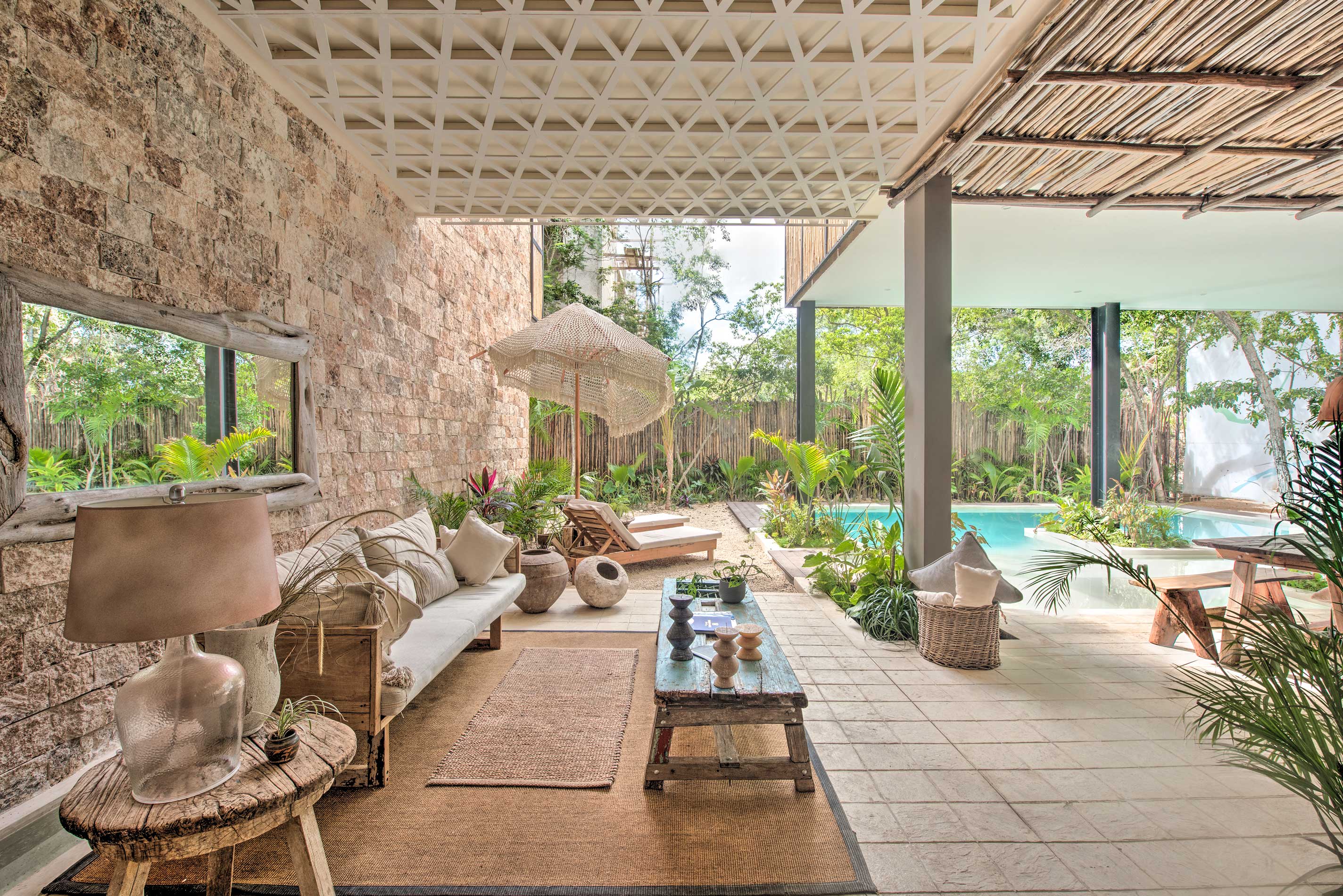 Enjoy access to this patio and pool during your stay at this Tulum condo!