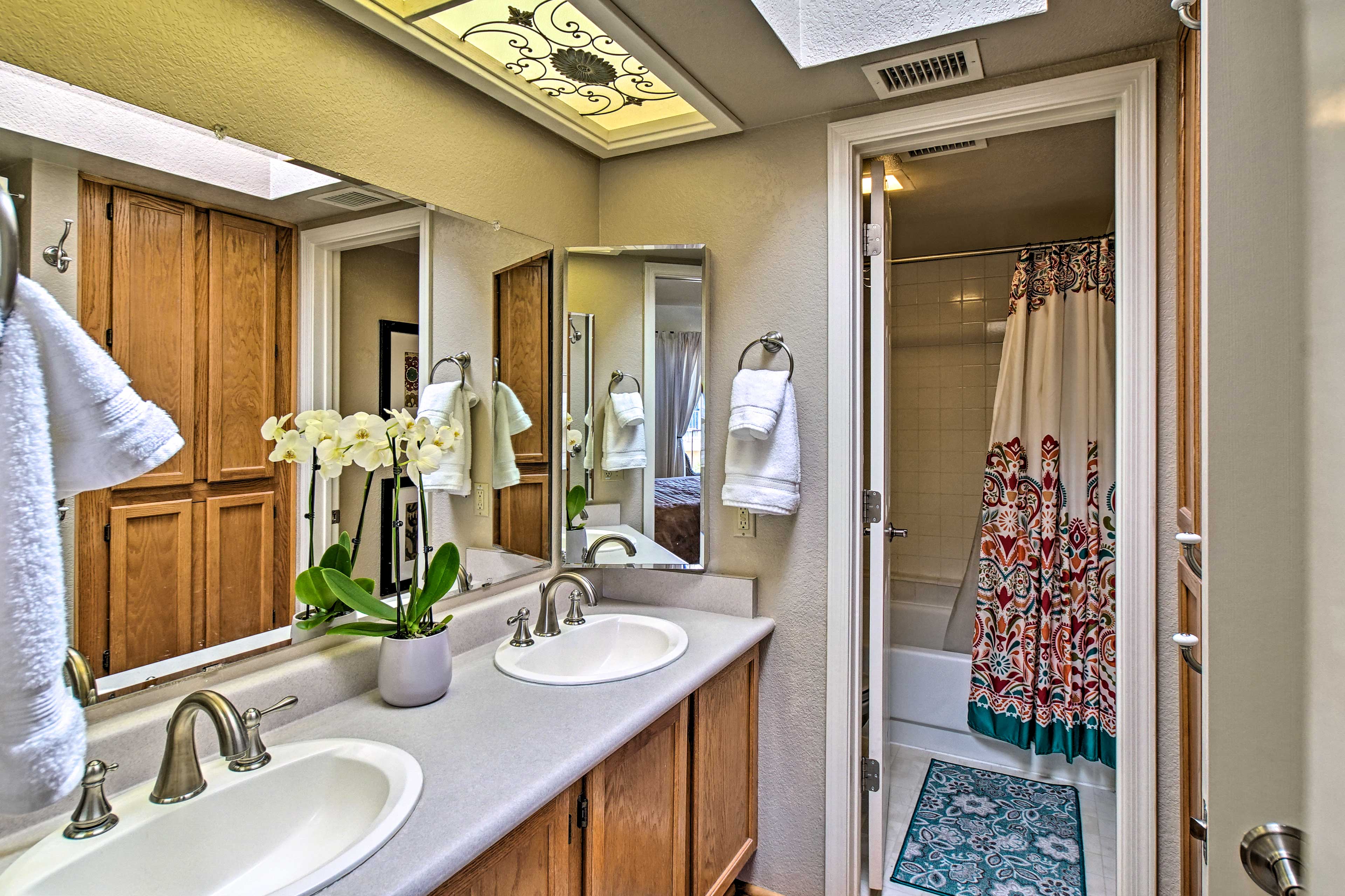 The Jack-and-Jill bathroom has 2 sinks, and a shower/tub combo.