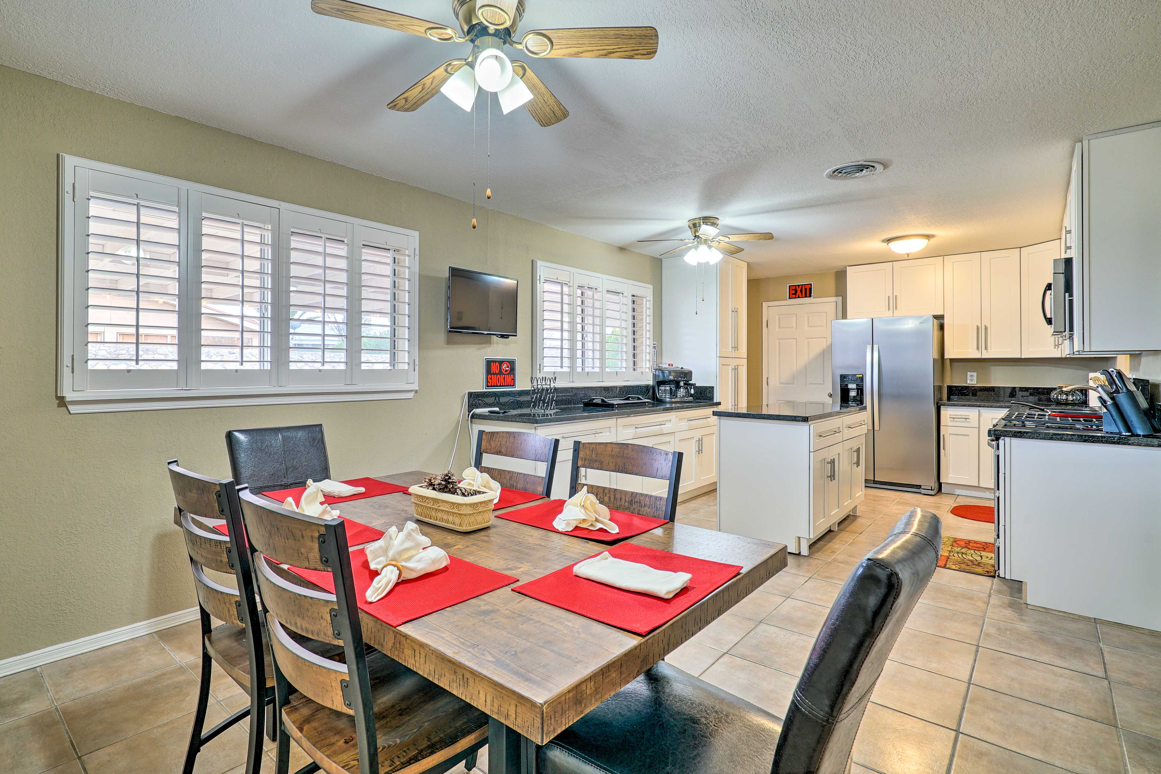 An open doorway leads into the kitchen and dining area.