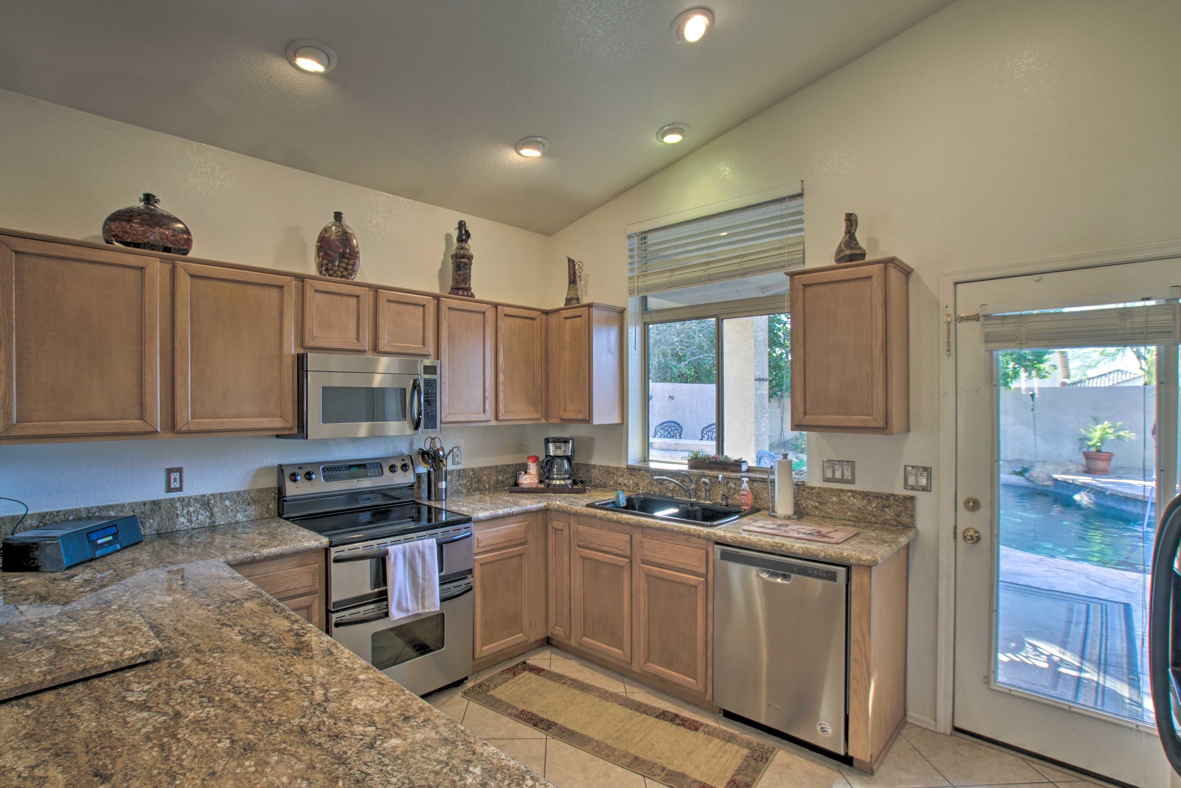 This kitchen is fully equipped and stocked with cooking basics.