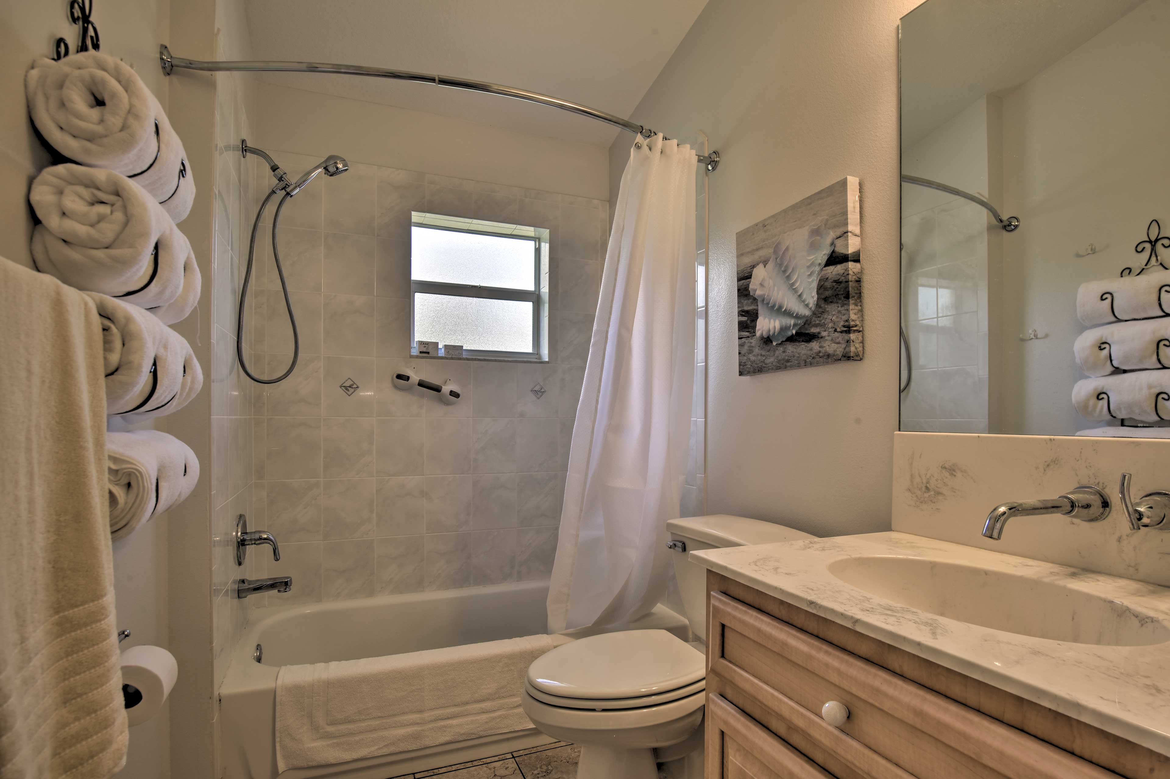 The full bath is equipped with a shower/tub combo.