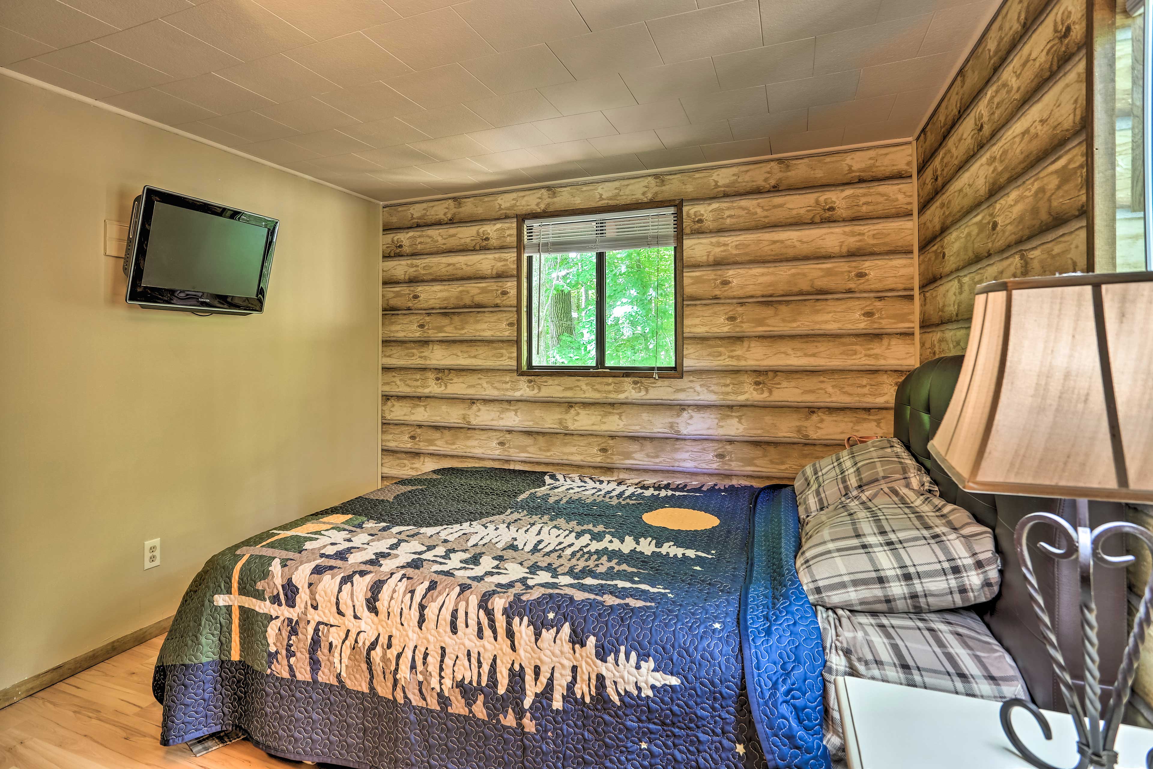 The second bedroom has a queen-sized bed and Smart TV.