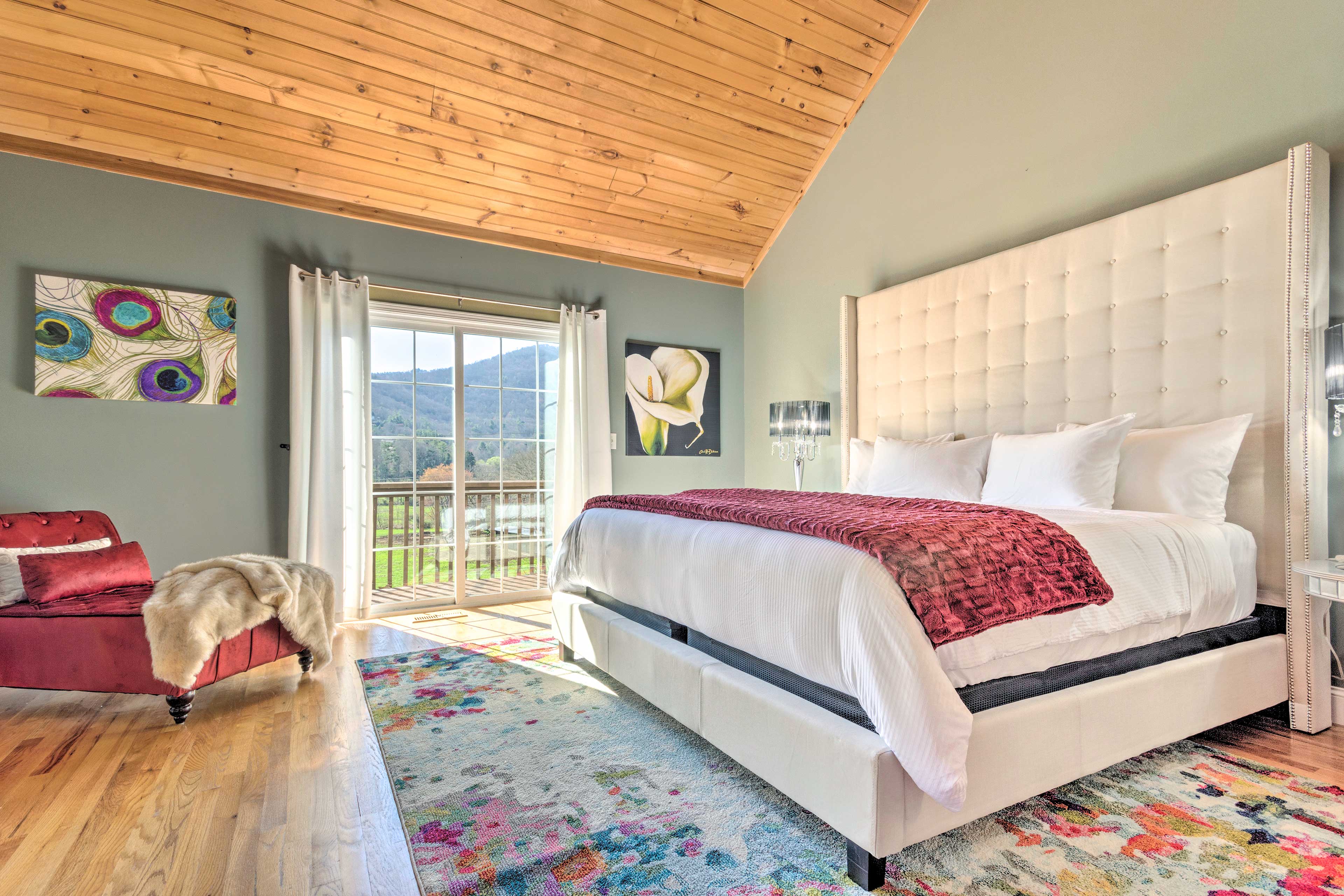 This bedroom features a king bed and stunning views.