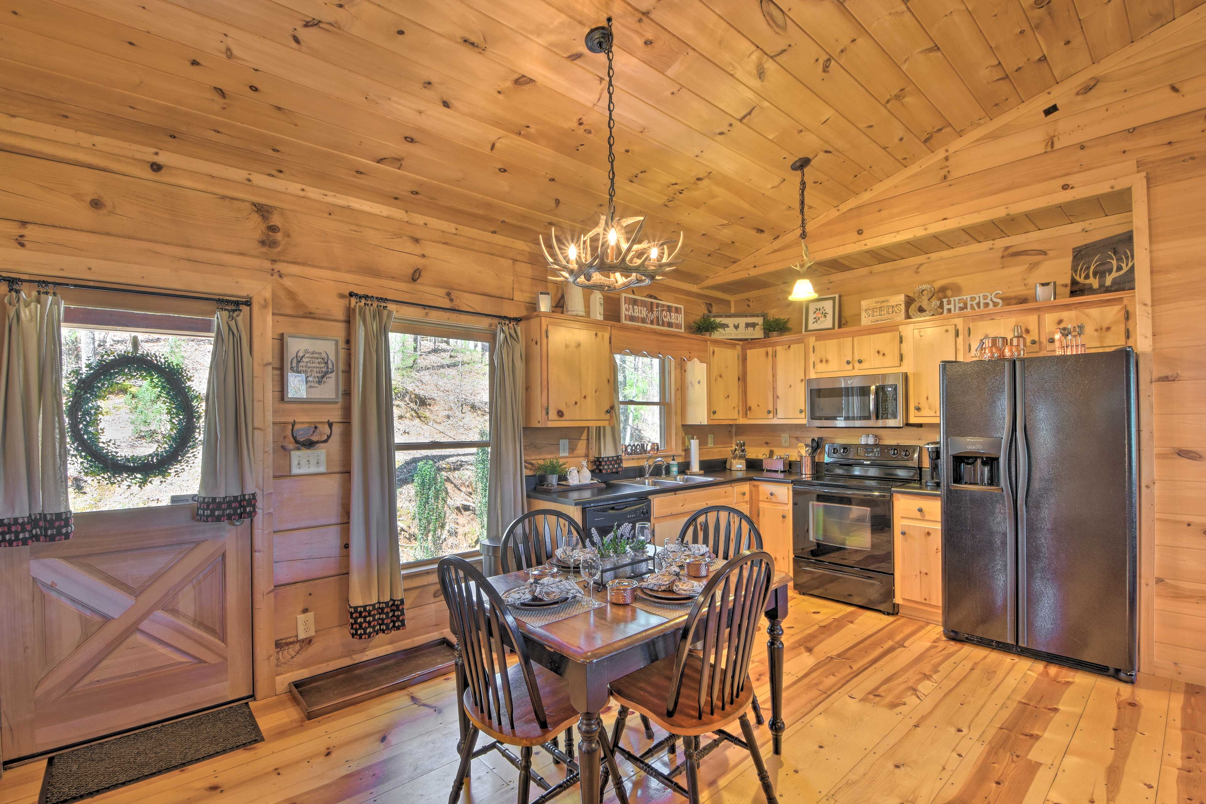 The fully equipped kitchen includes a dishwasher, french press, and Keurig.