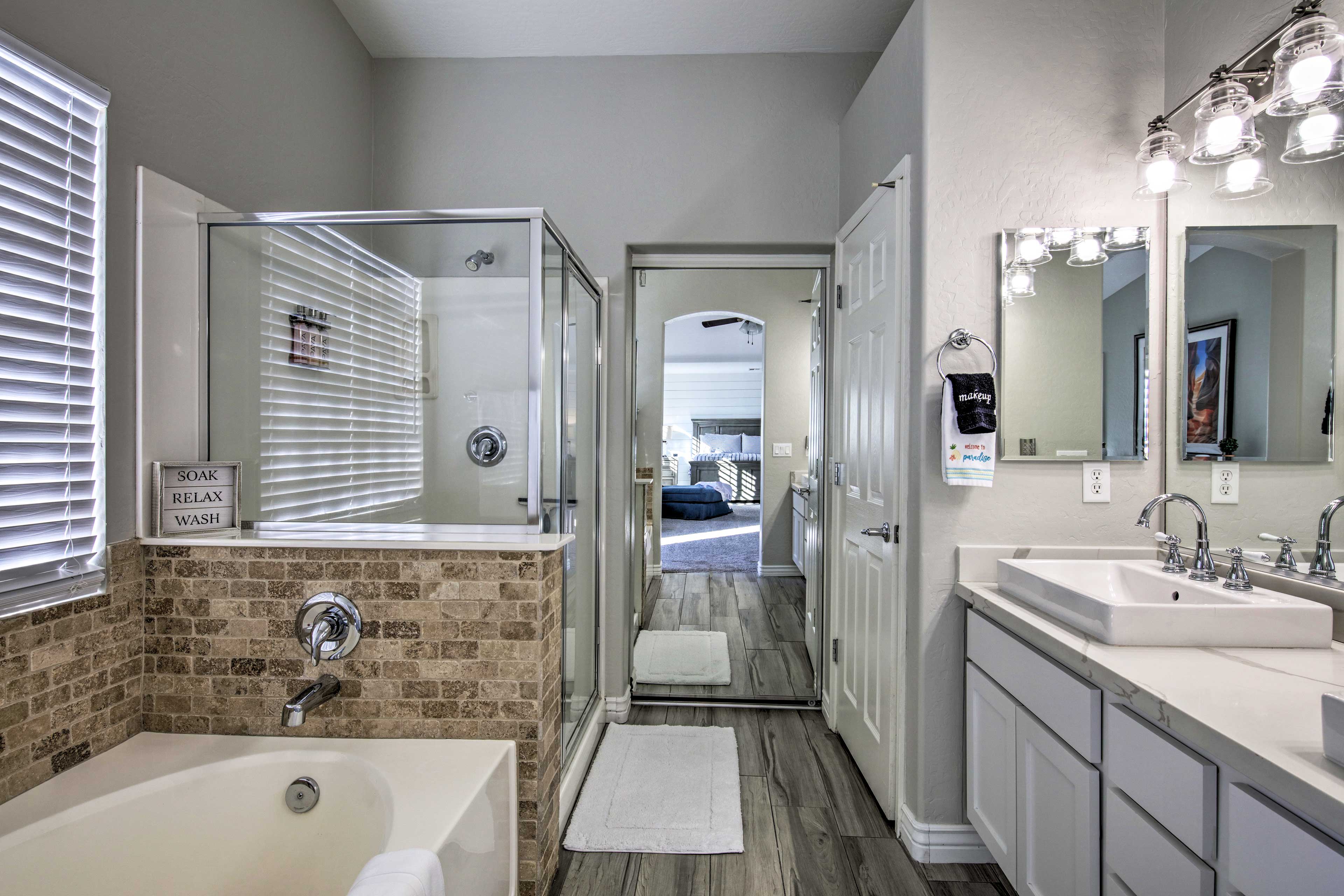 Take a shower or a bath in this elegant bathroom.