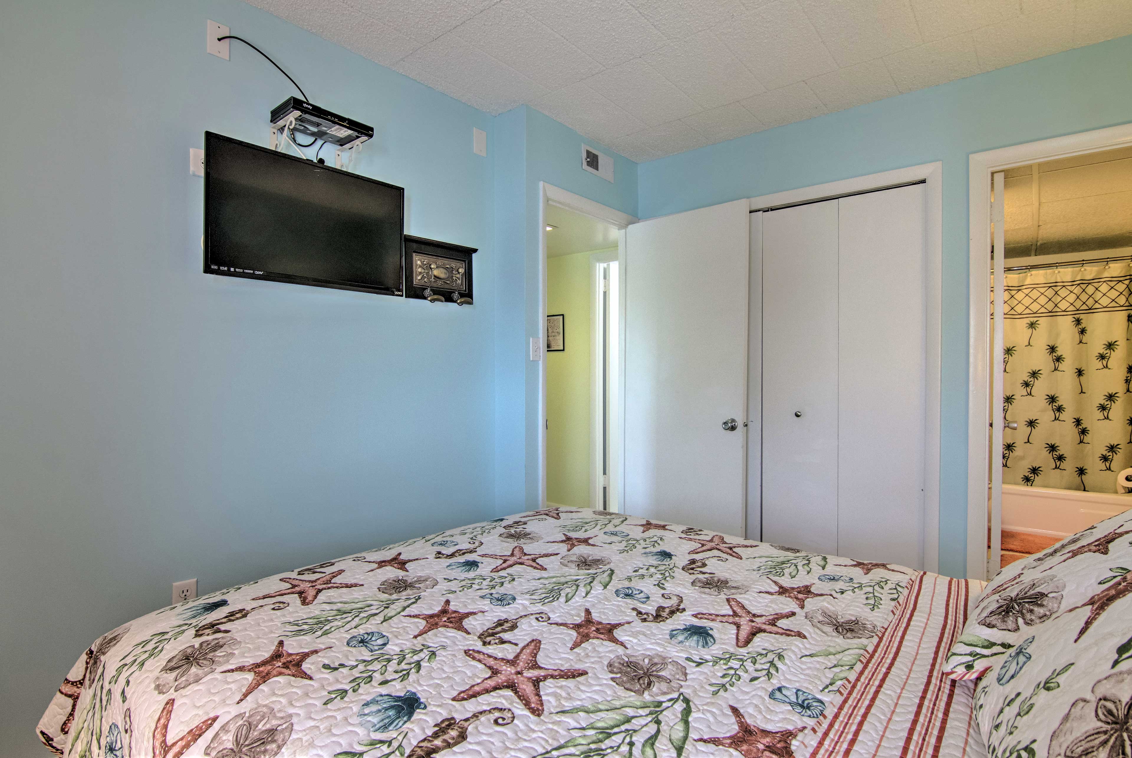 Turn the flat-screen TV on in the primary bedroom and watch your favorite show!