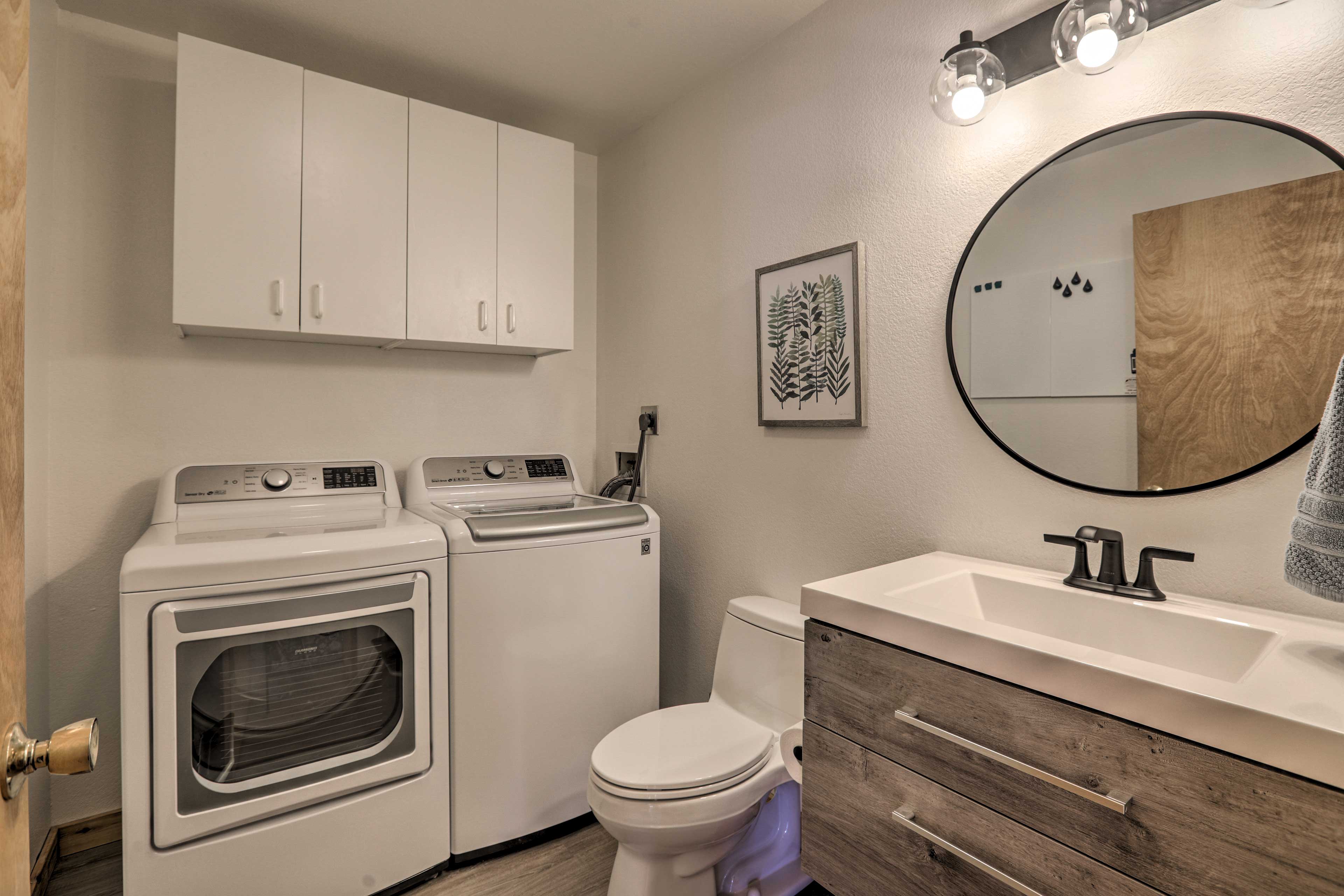 The half bathroom includes a washer and dryer.