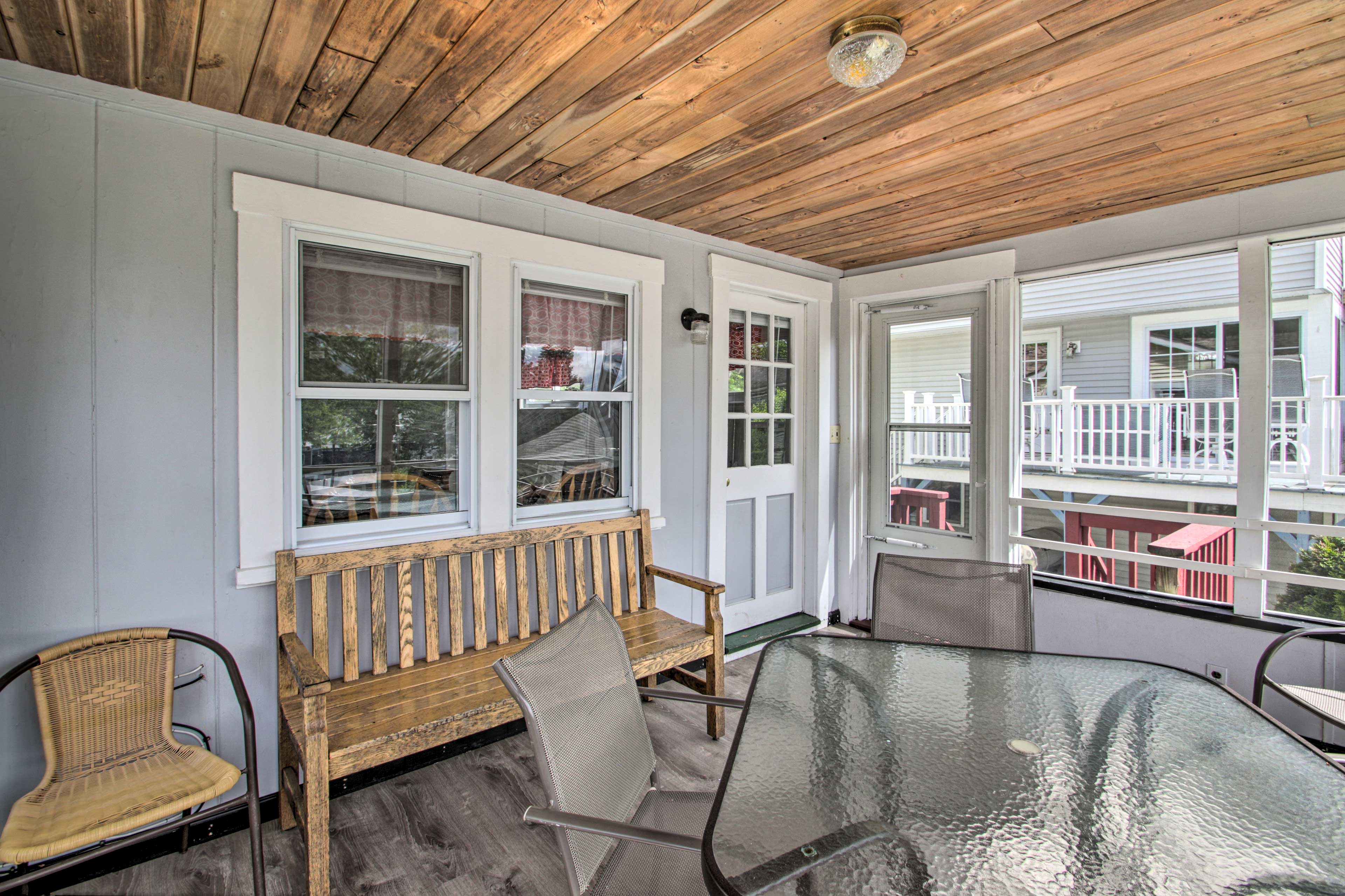 Play cards, enjoy drinks, and feel the breeze on the private screened-in porch.