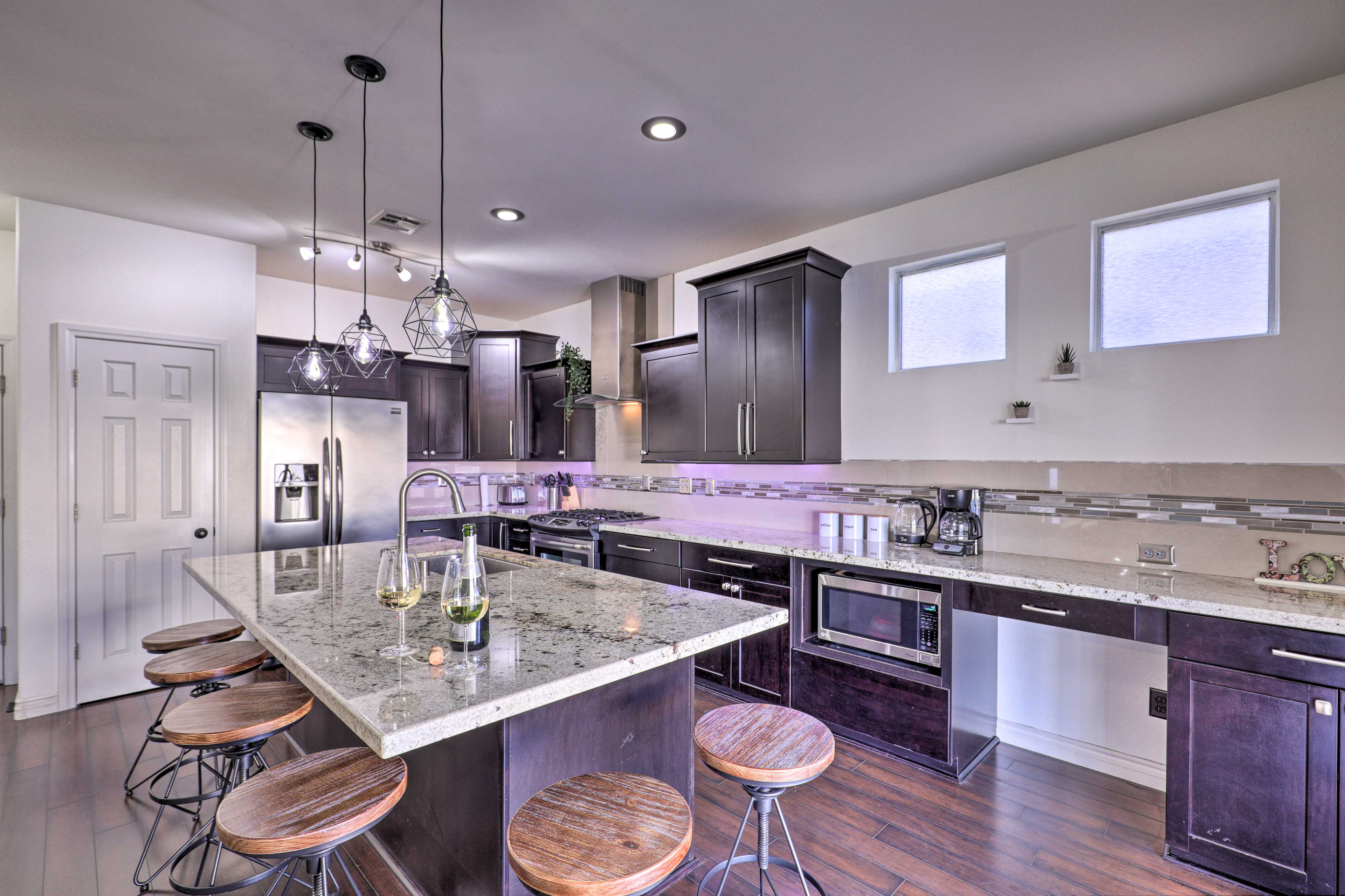 The kitchen offers stainless steel appliances and granite counters.