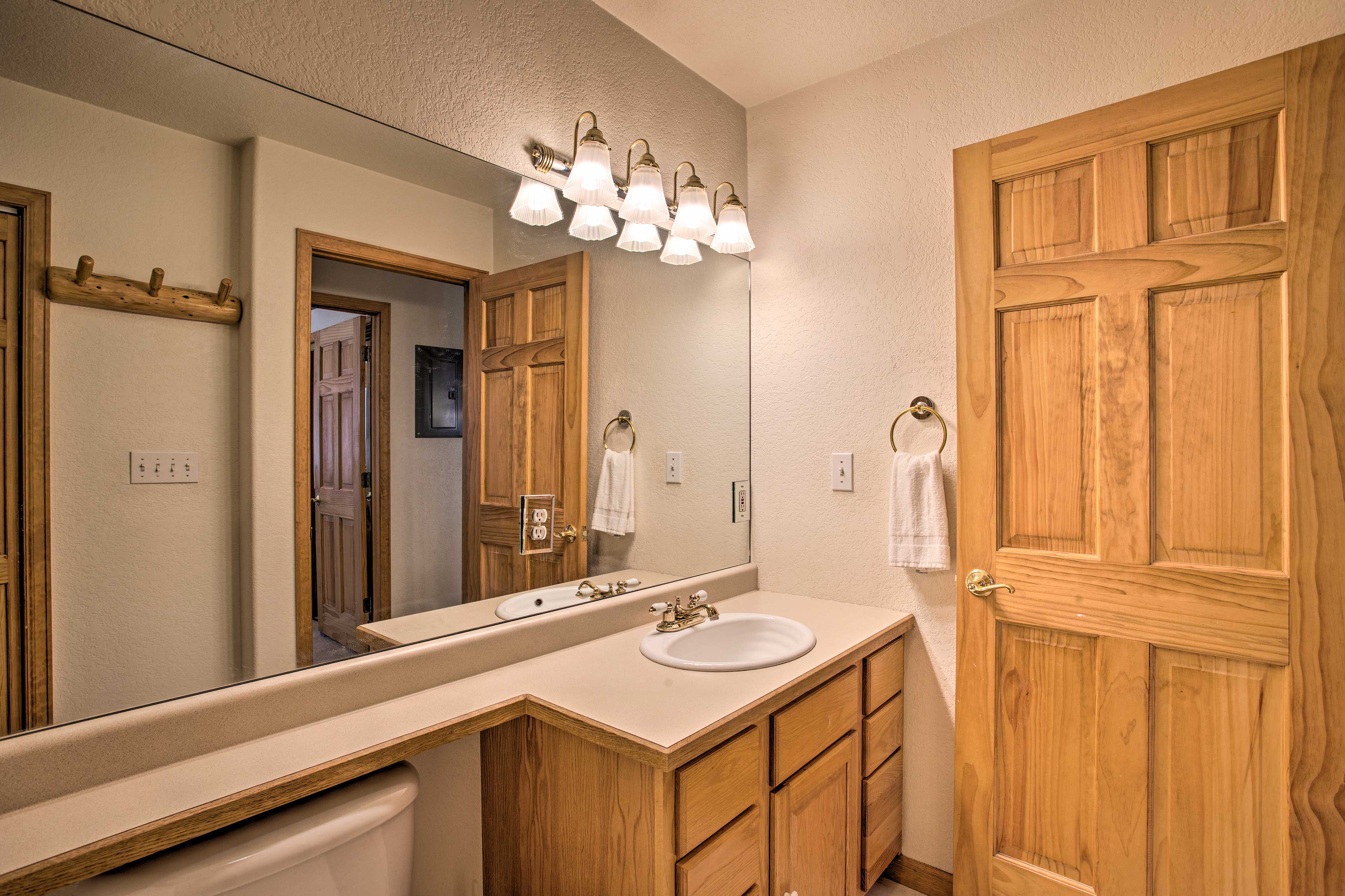 This spacious bathroom is the perfect place to get ready.