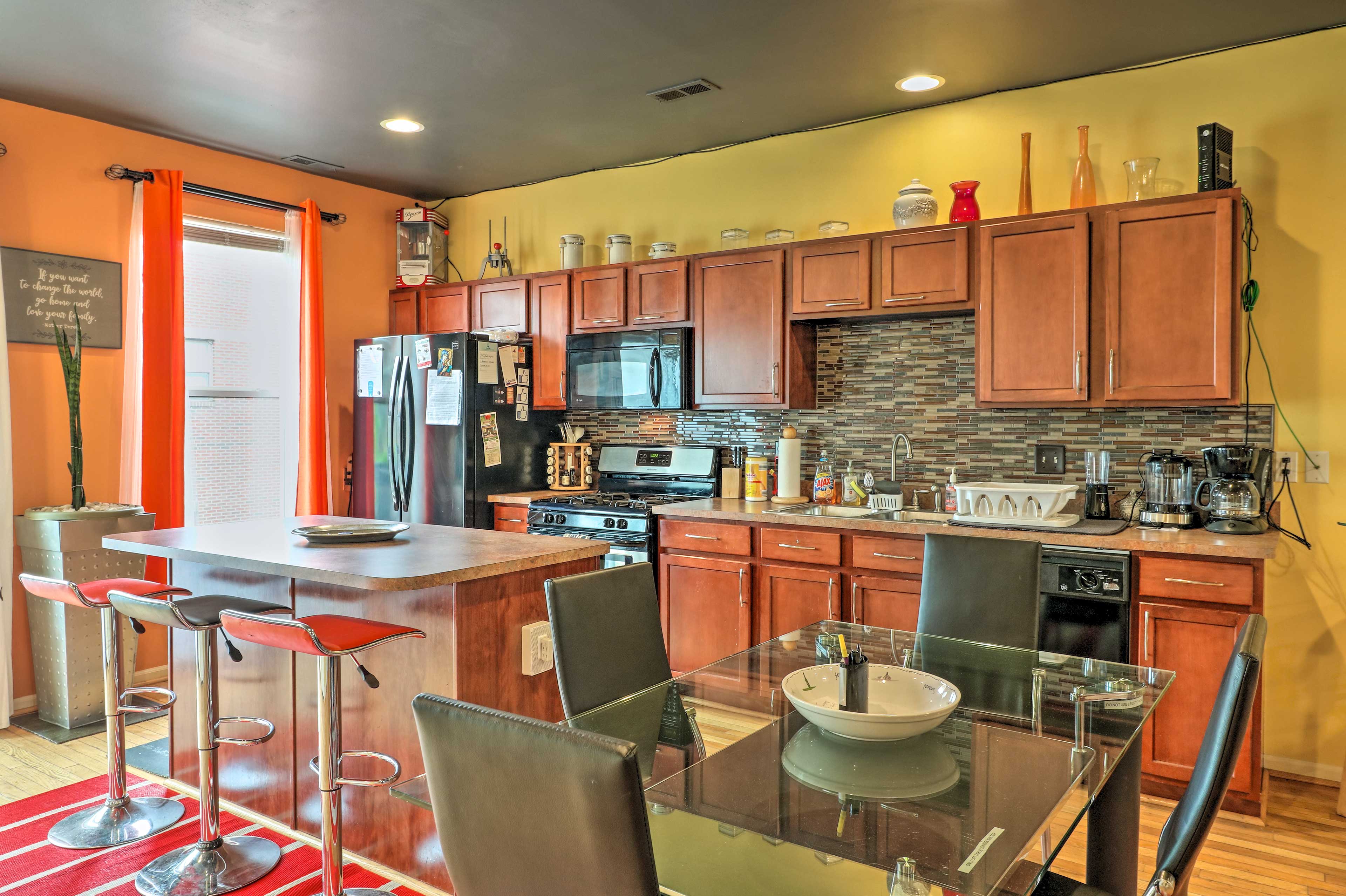 The dining area opens to the full kitchen.