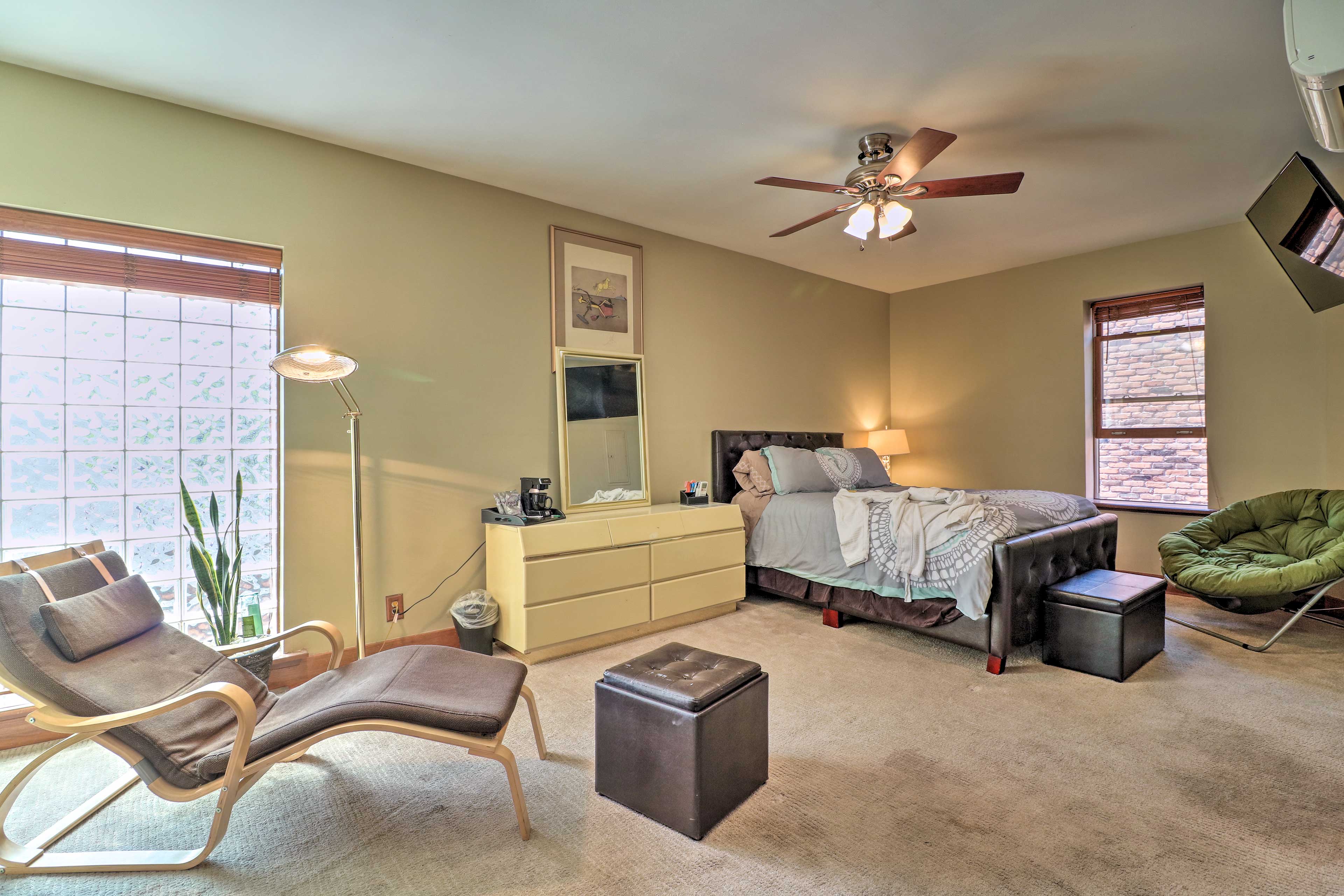 The bedroom suite includes a lounge chair.