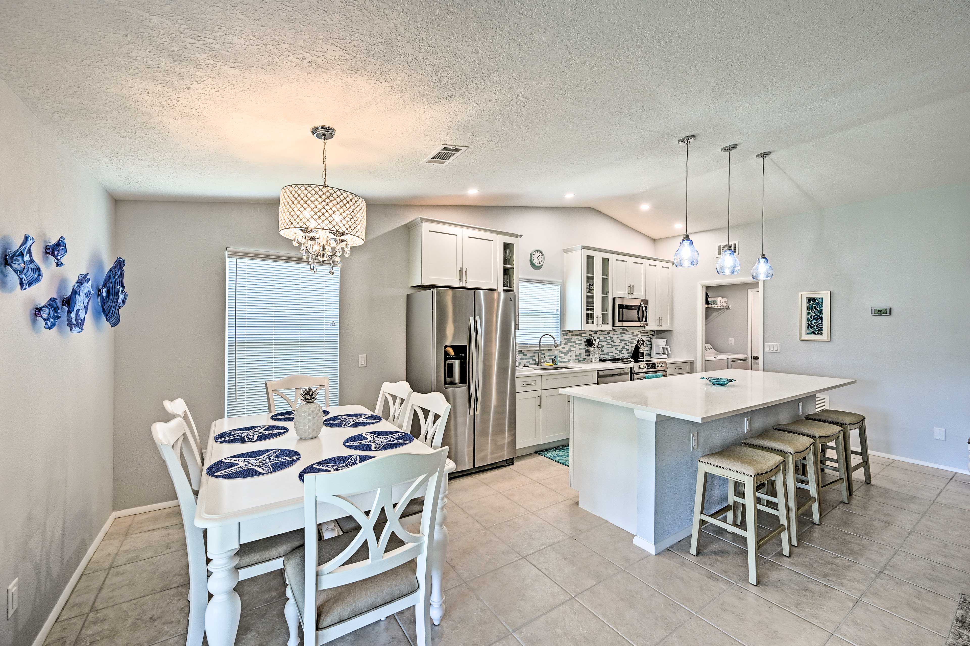 This 3-bedroom, 2-bathroom vacation rental has a full kitchen and dining table.