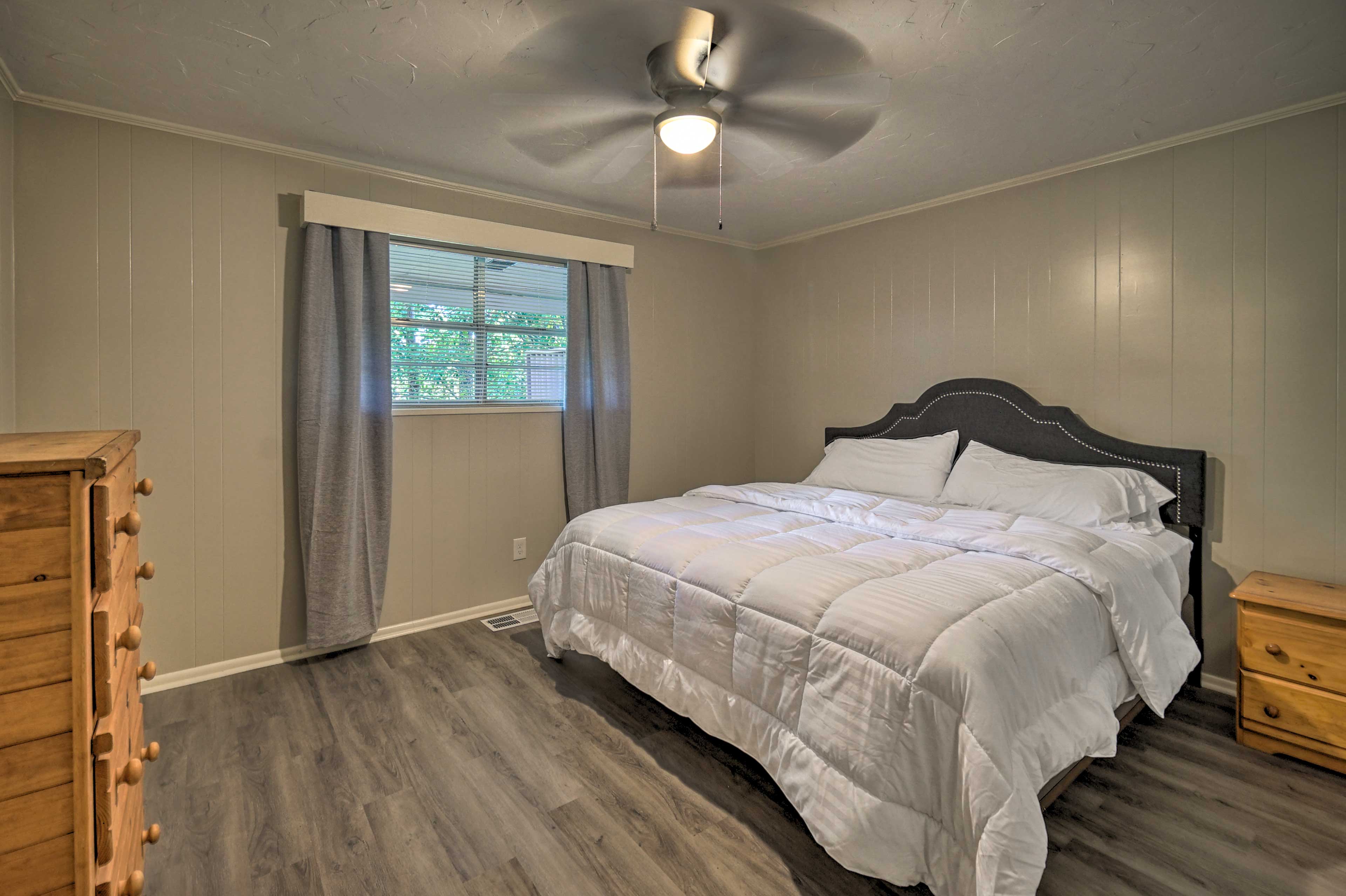 This second bedroom features a California king bed.
