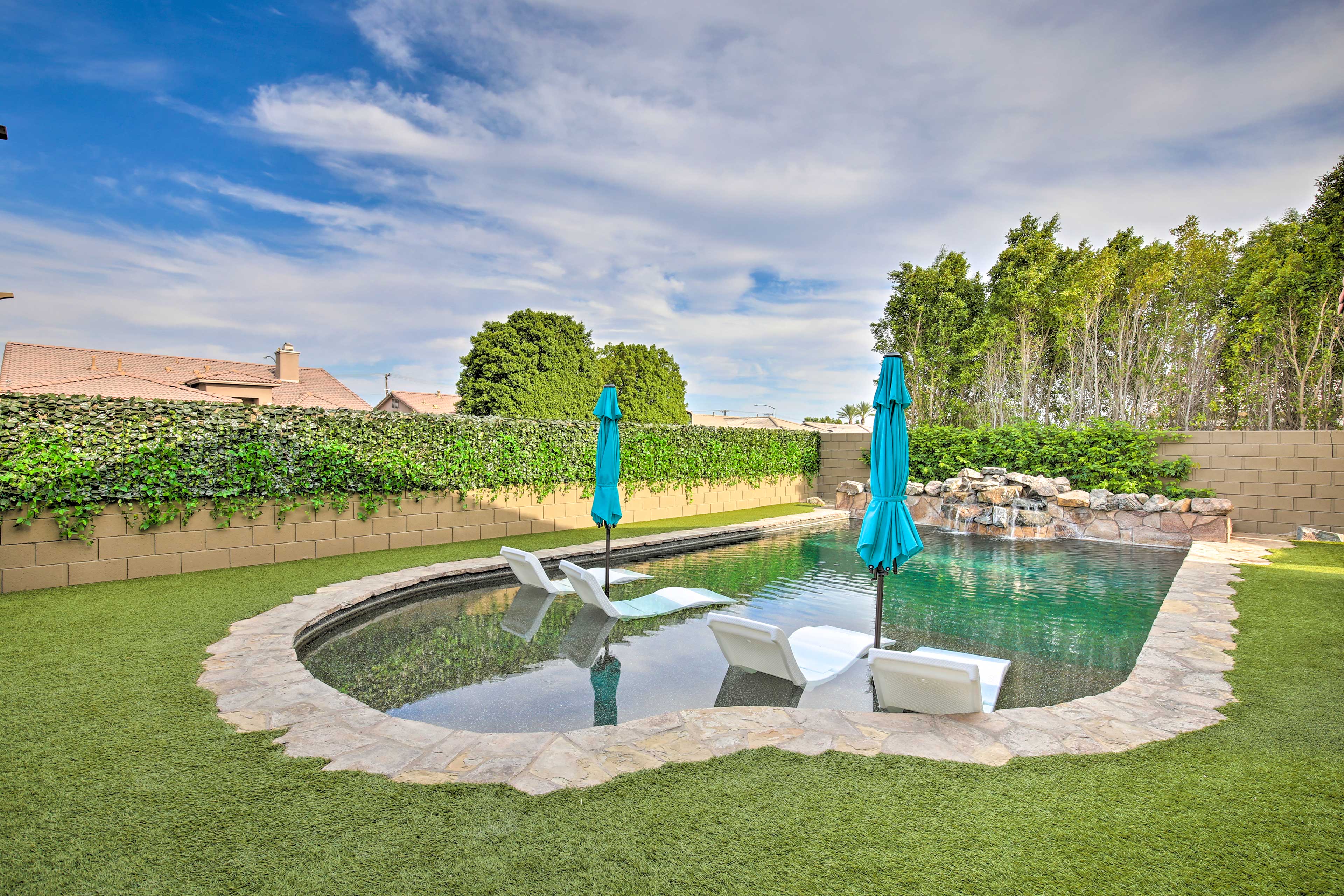 The yard's private pool is perfect for sun bathing & soaking.