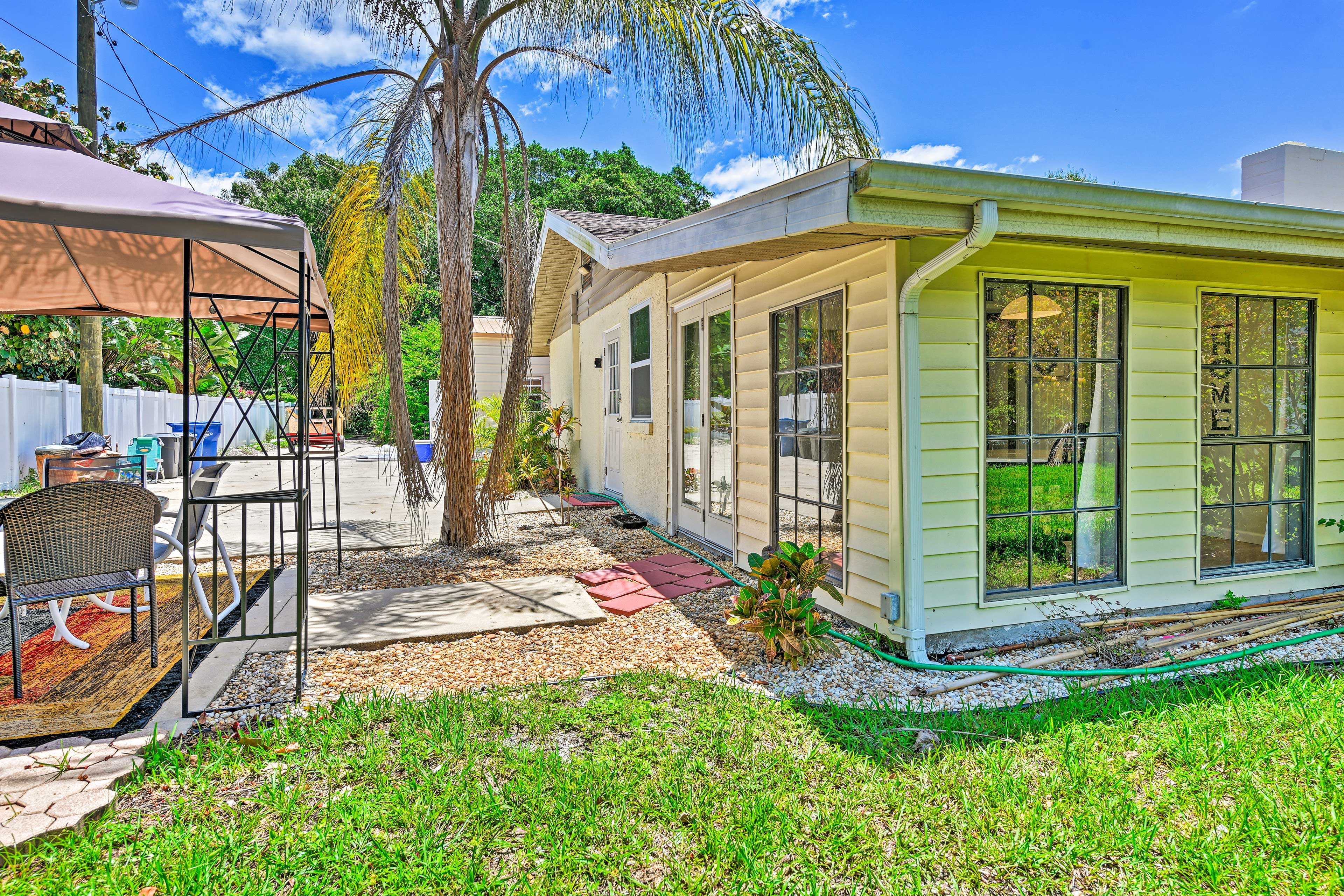 Step down the charming walkway to the pergola.