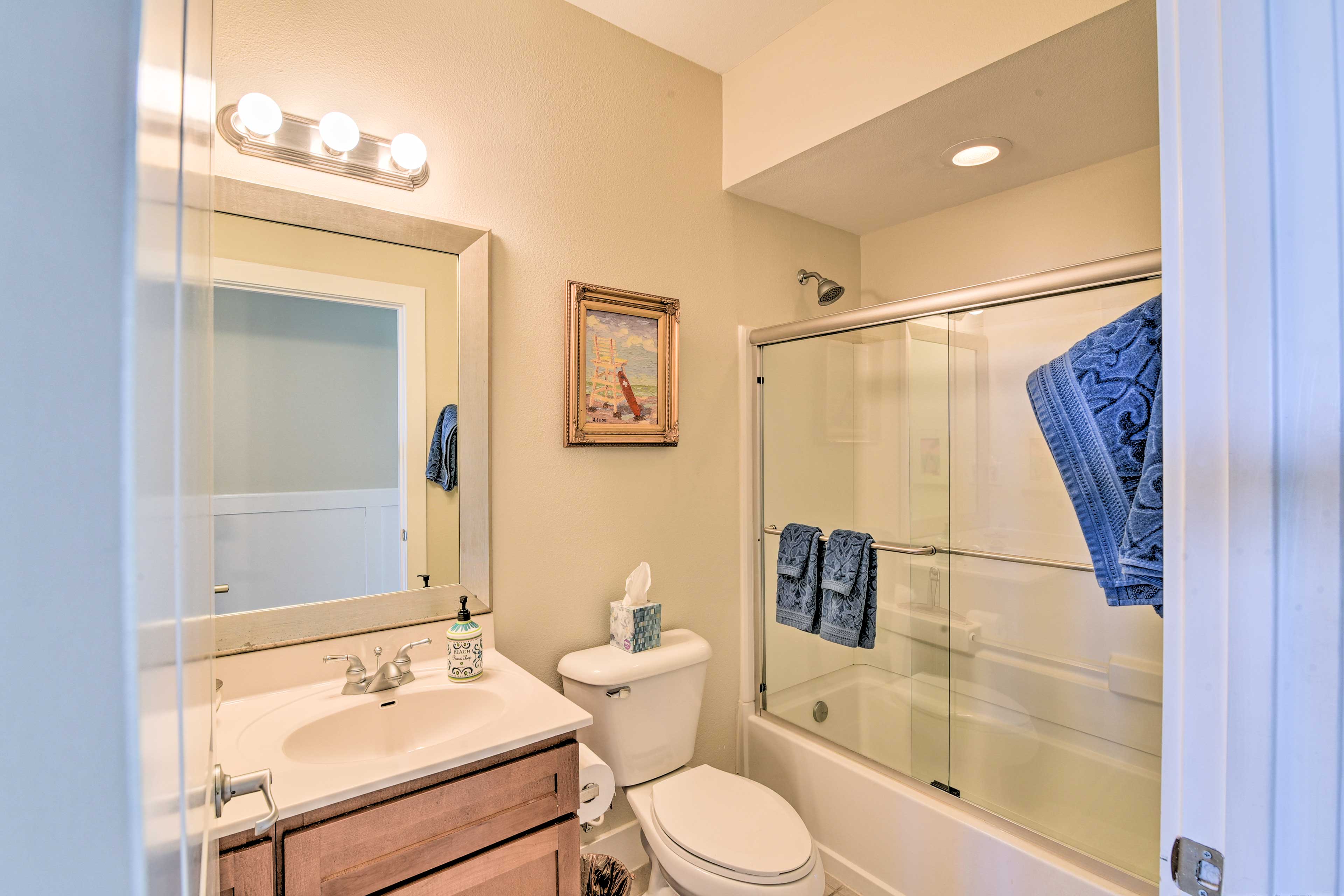 The third bathroom has a shower/tub combo.